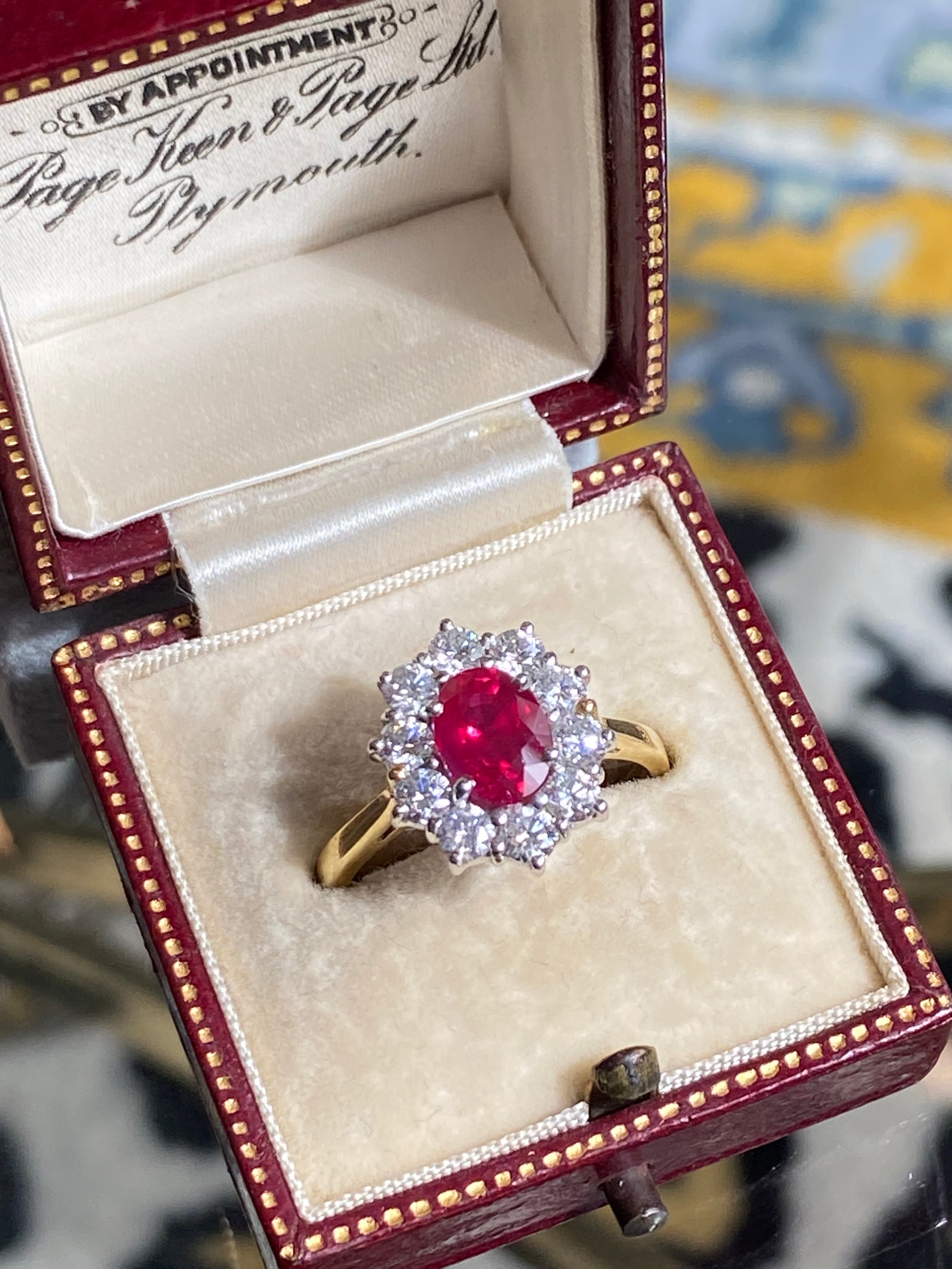 Breathtaking Ruby and Natural Diamond Halo Ring in 18ct Gold