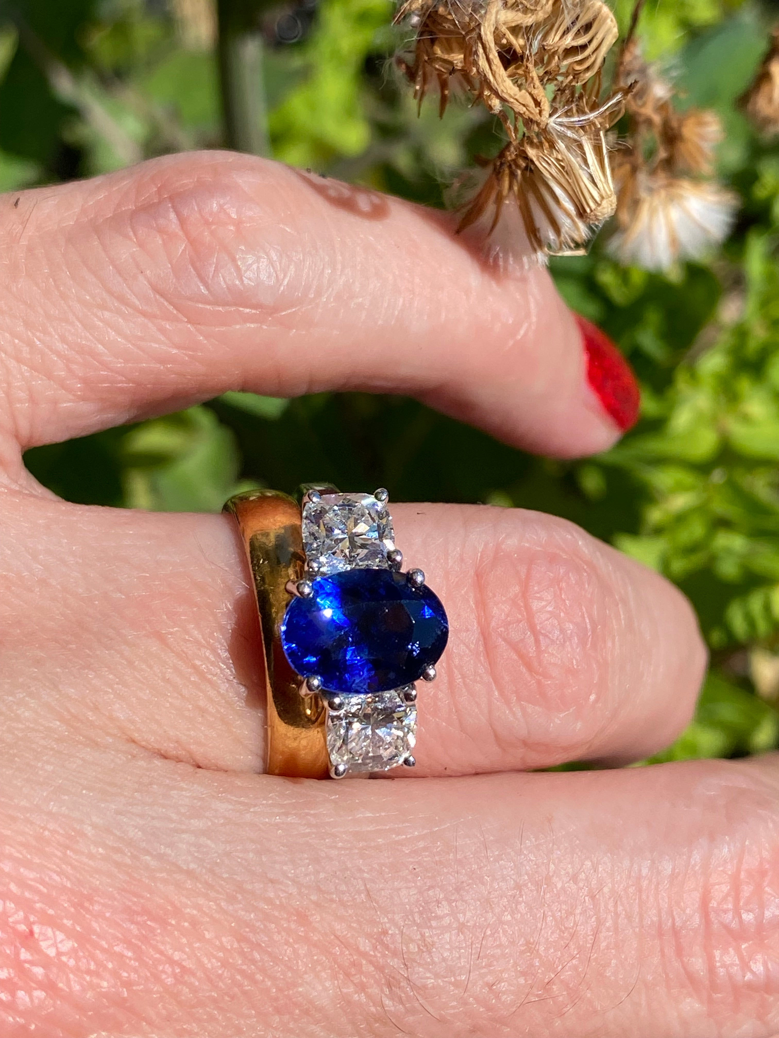 4.33 CTW Blue Ceylon Sapphire and Natural Diamond Three Stone Engagement Ring in Platinum