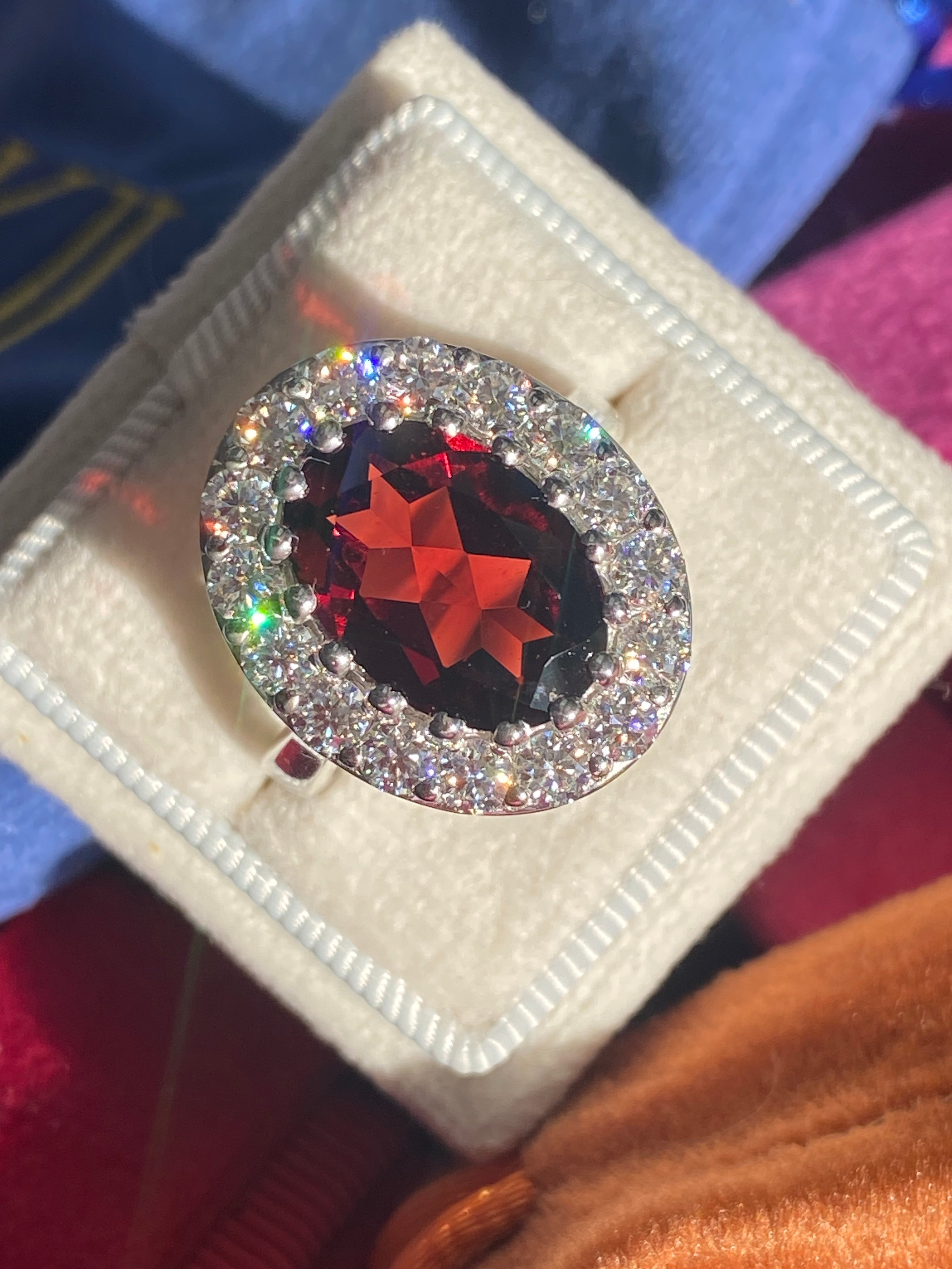 8.25 CTW Oval Cut Garnet and Moissanite Halo Cocktail Ring in Sterling Silver