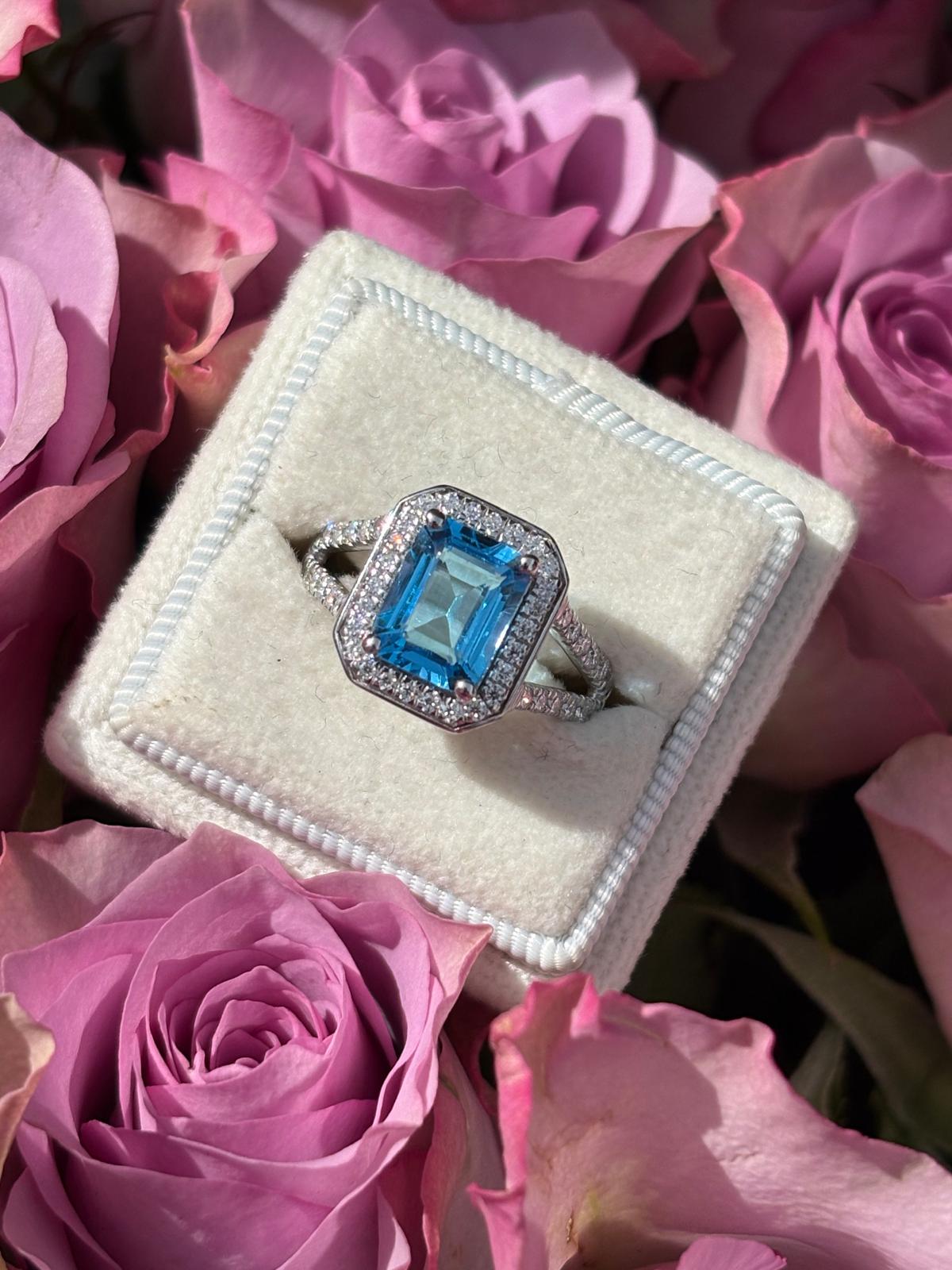 3.10 CTW Emerald Cut Moissanite and Blue Topaz Halo Ring in Sterling Silver