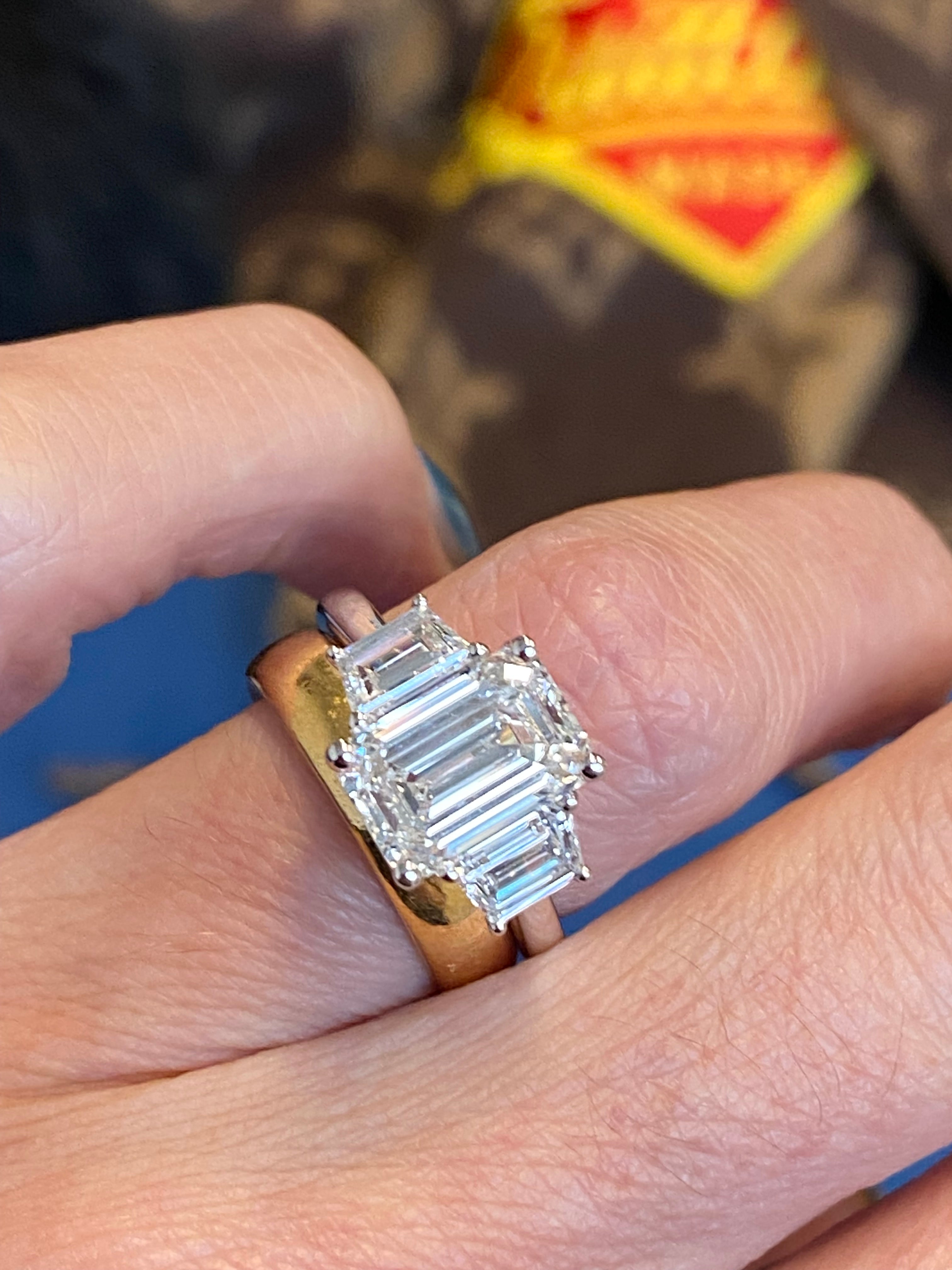 3.93 CTW Emerald and Trapezoid Cut D Colour VS1 Lab Diamond Three Stone Ring in Platinum