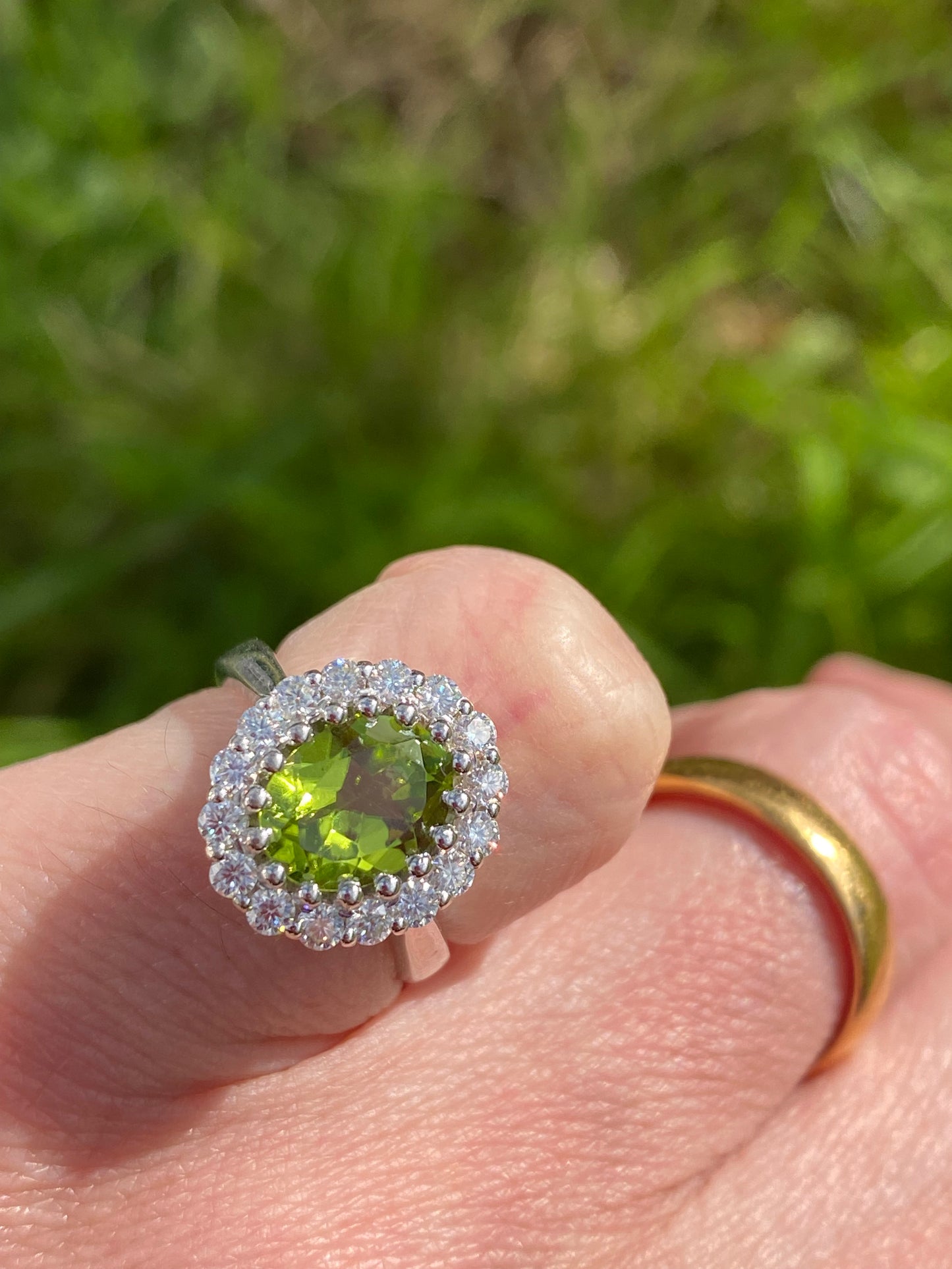 2.33 CTW Oval Cut Peridot and Moissanite Halo Cocktail Ring in Sterling Silver
