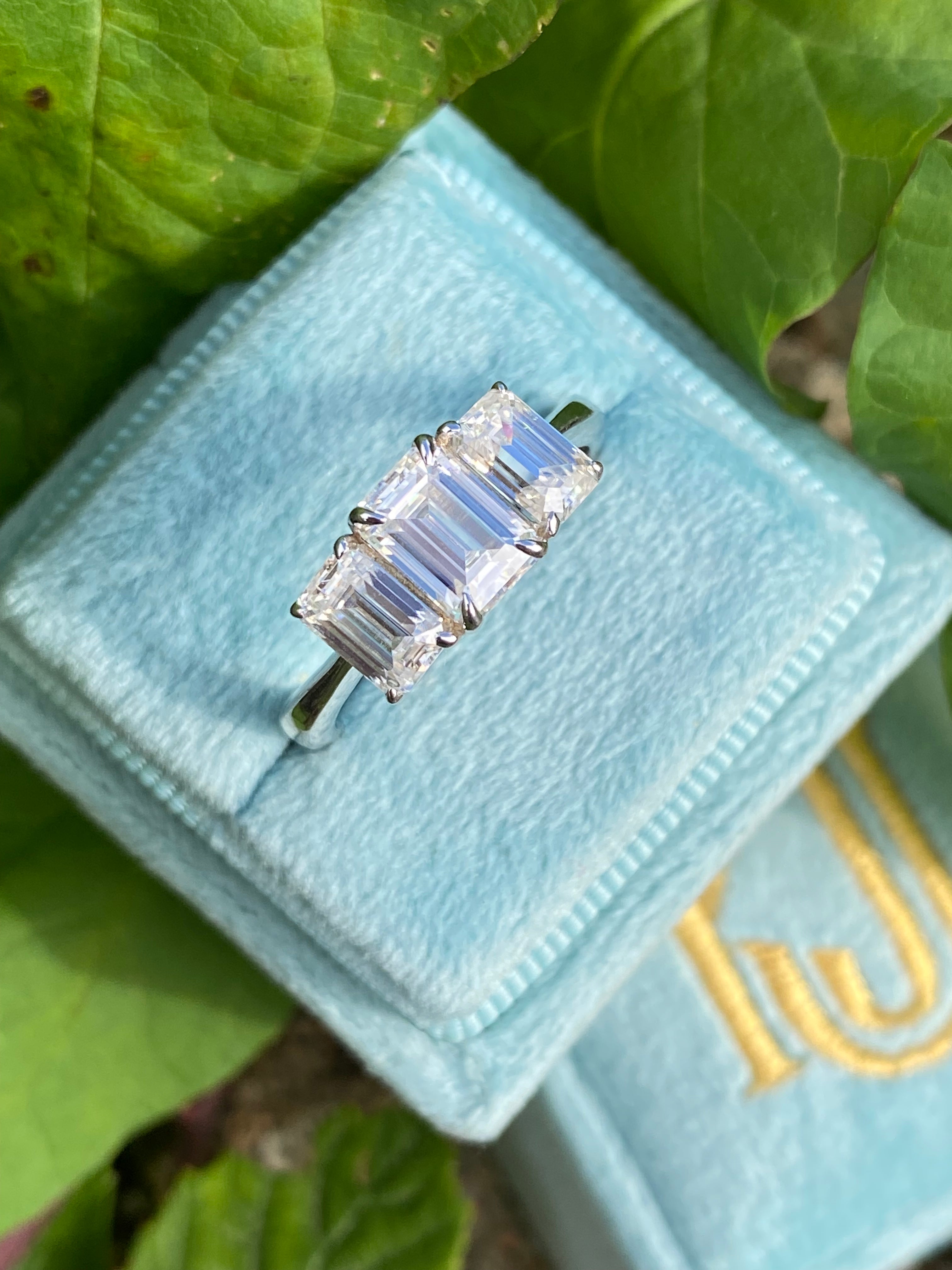 2.00 CTW Emerald Cut Moissanite Three Stone Engagement Ring in Sterling Silver