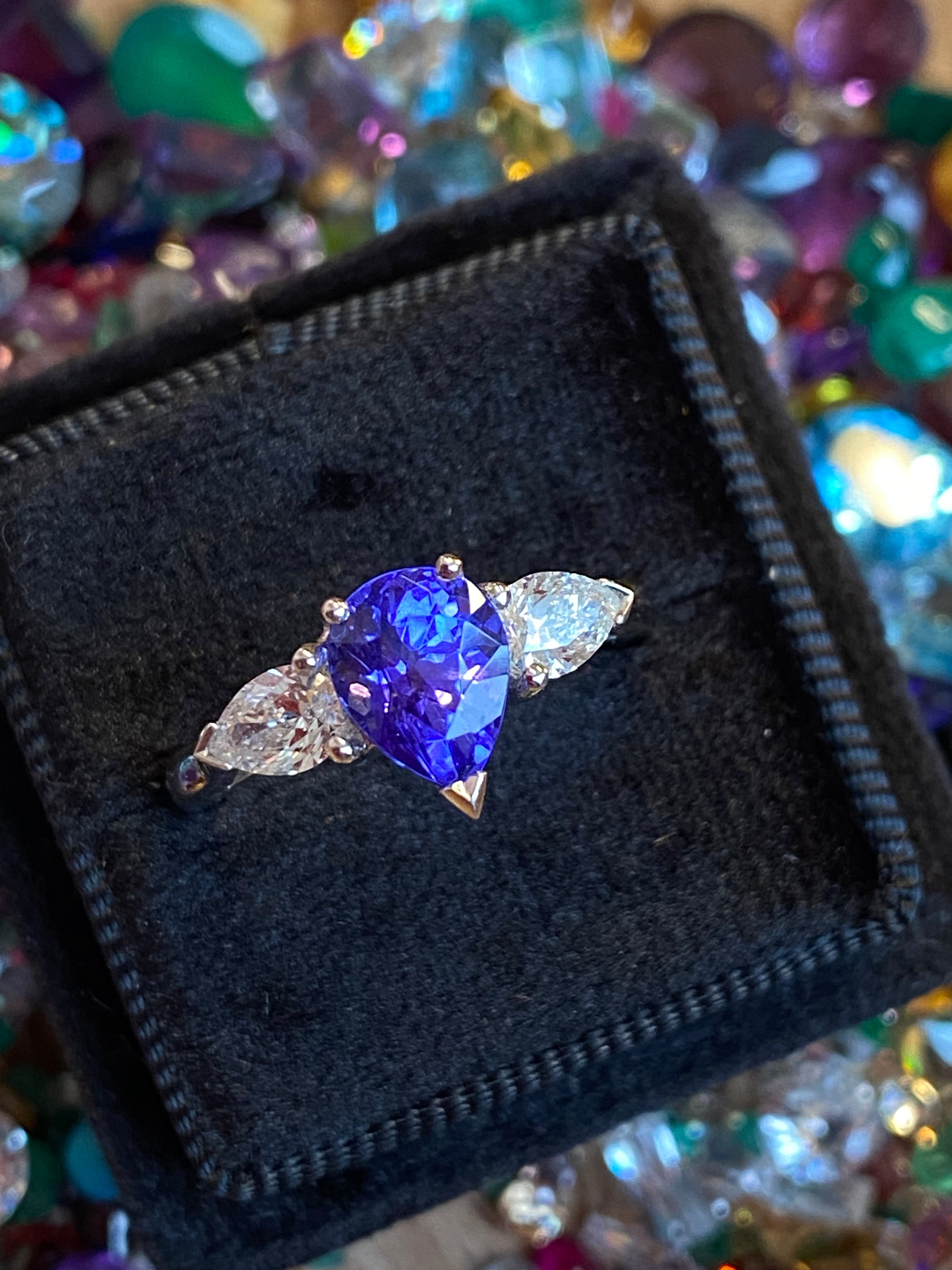 2.47 CTW Pear Cut Tanzanite and Natural Diamond Three Stone Ring in Platinum