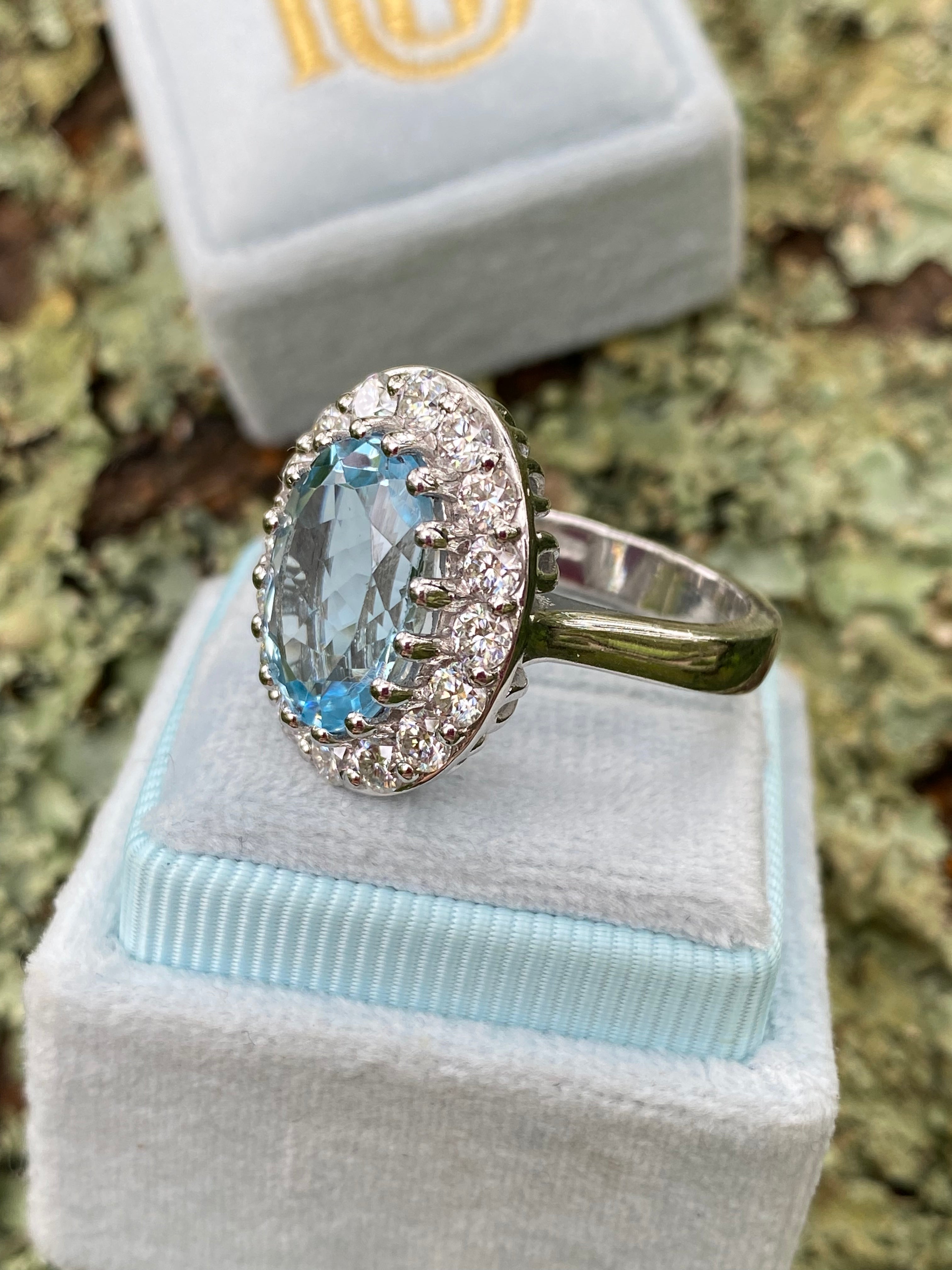 9.60 CTW Oval Cut Blue Topaz and Moissanite Halo Cocktail Ring in Sterling Silver