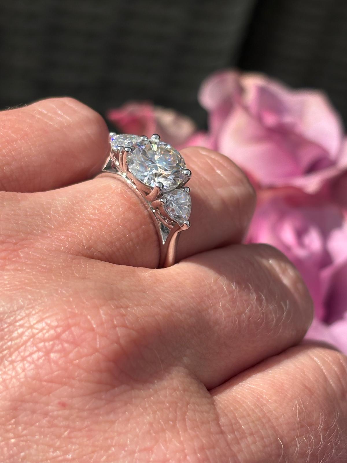 3.40 CTW Round and Heart Shape Moissanite Three Stone Ring in Sterling Silver