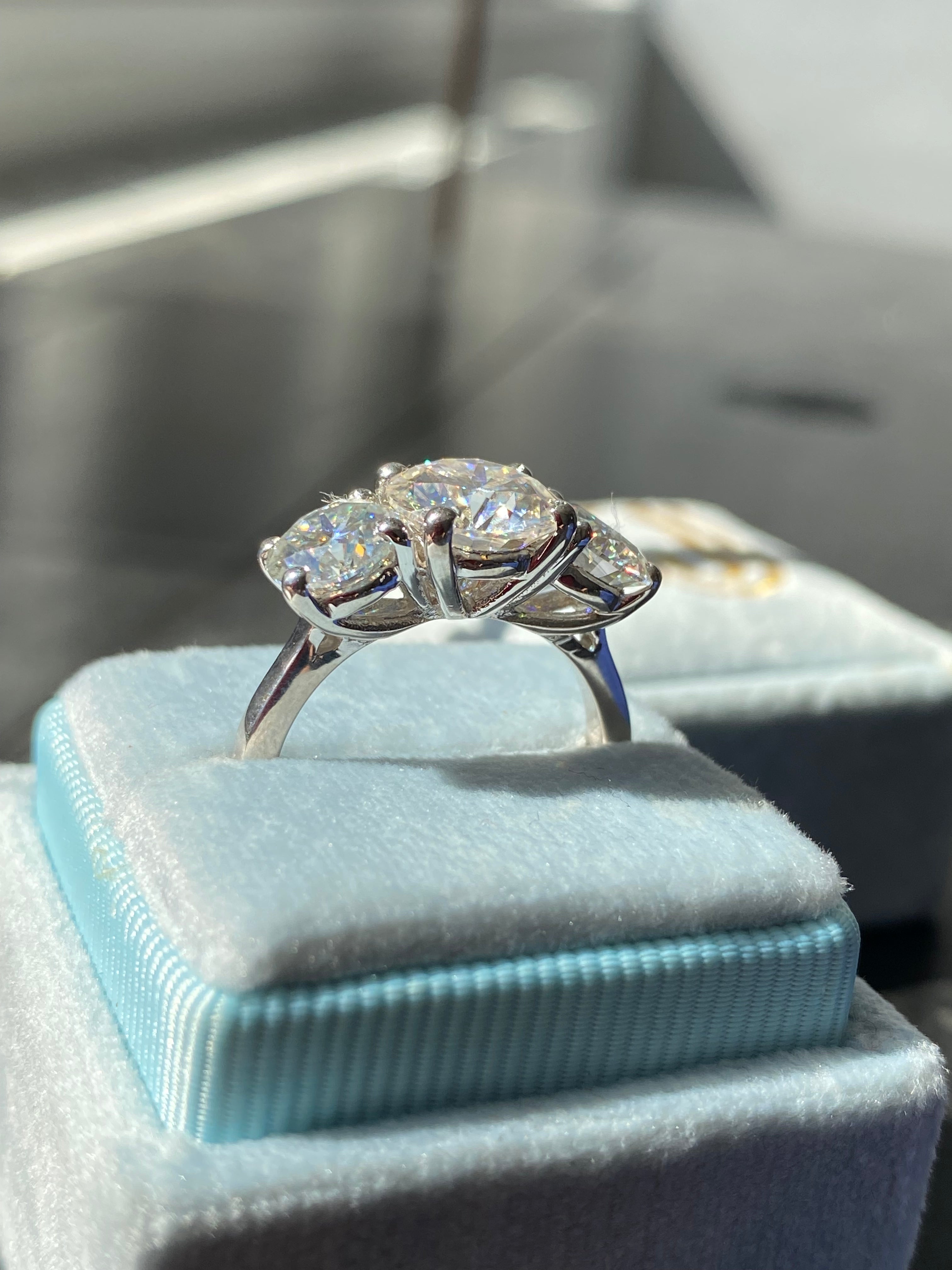 4.00 CTW Round Cut Moissanite Three Stone Ring in Sterling Silver