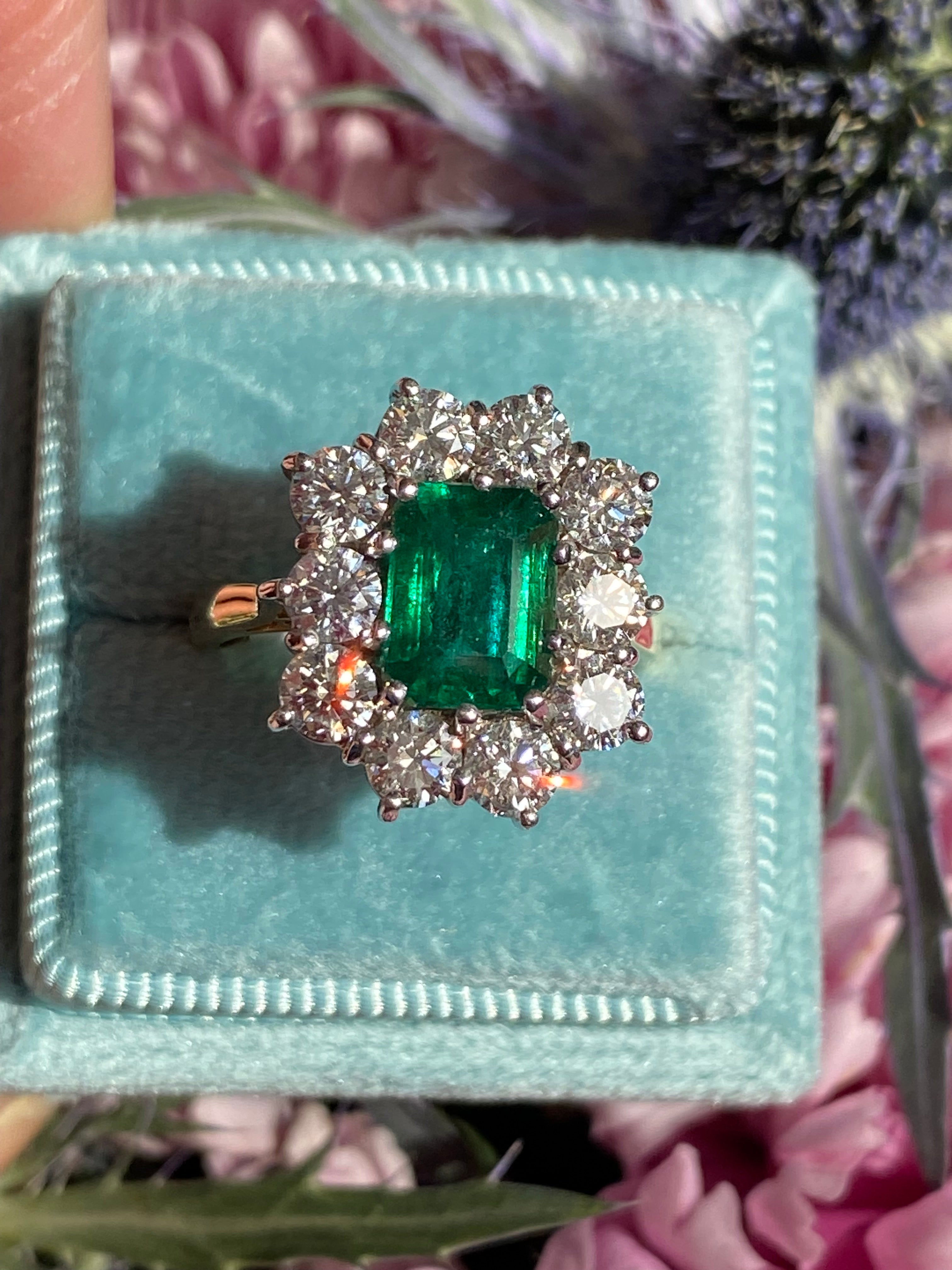 Outrageously Fantastic 4.17 CTW Emerald and Diamond Halo Ring in 18ct White and Yellow Gold