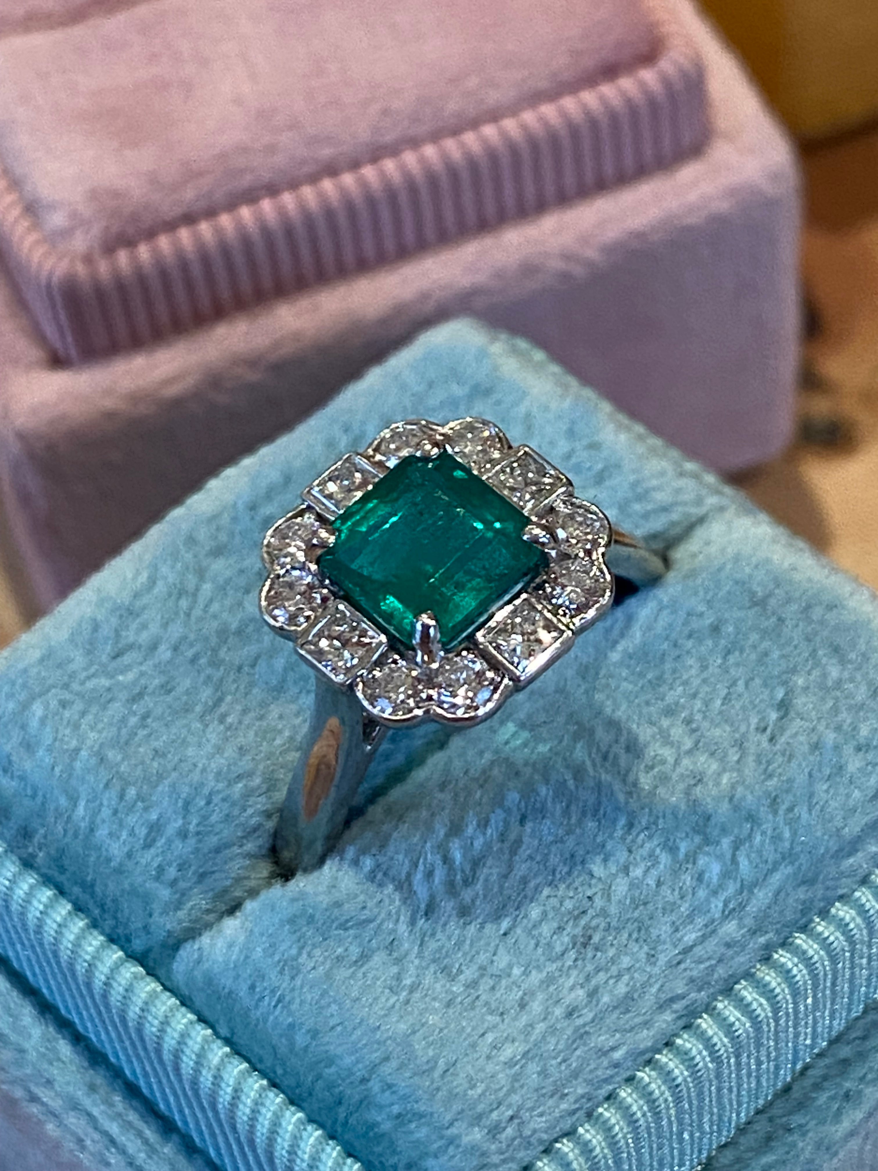 1.35 Carat Emerald Cut Emerald and 0.49 CTW Natural Diamond Halo Ring in Platinum