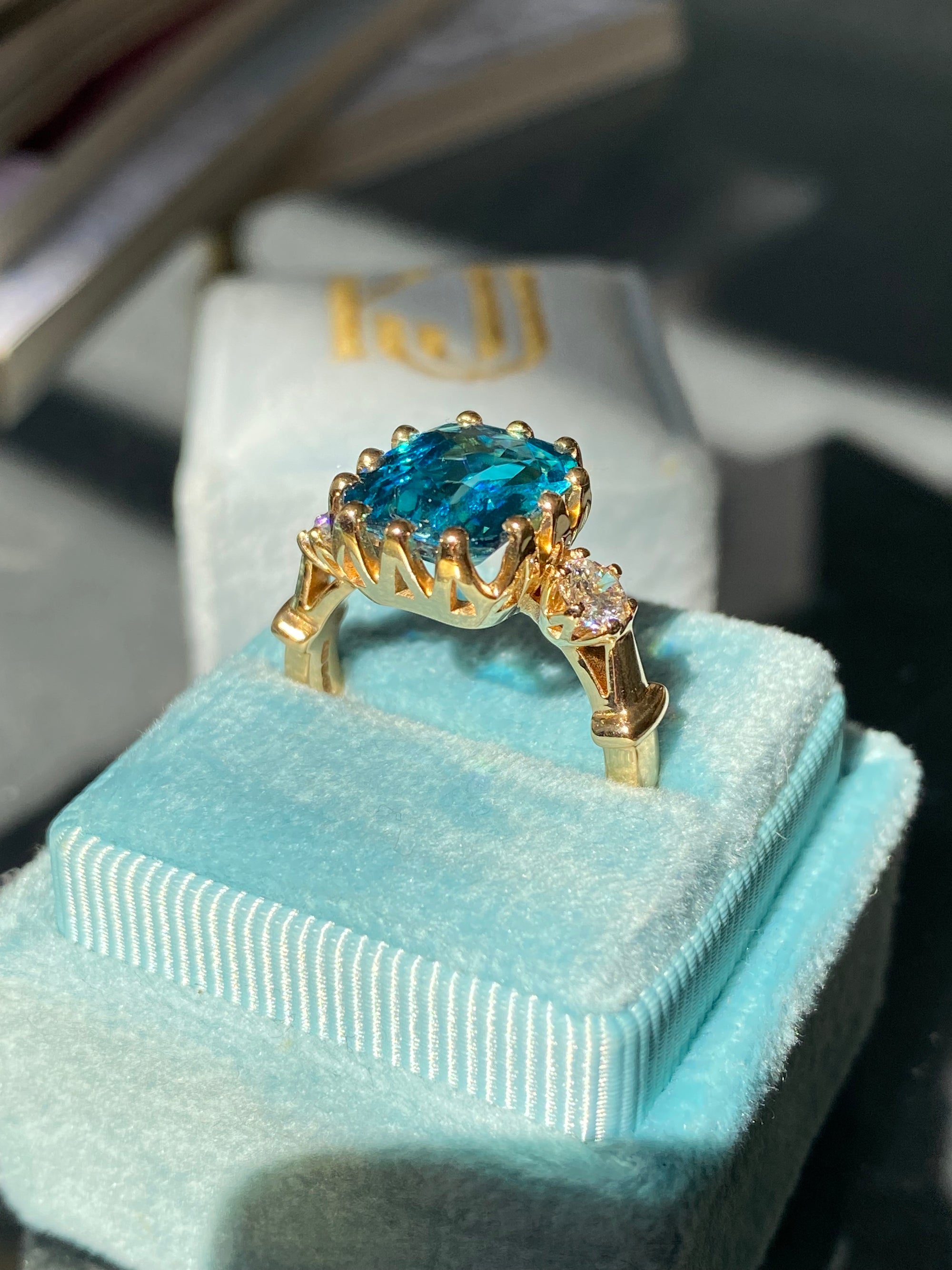 6.75 Carat Blue Zircon and Diamond Three Stone Ring in 18ct Yellow Gold