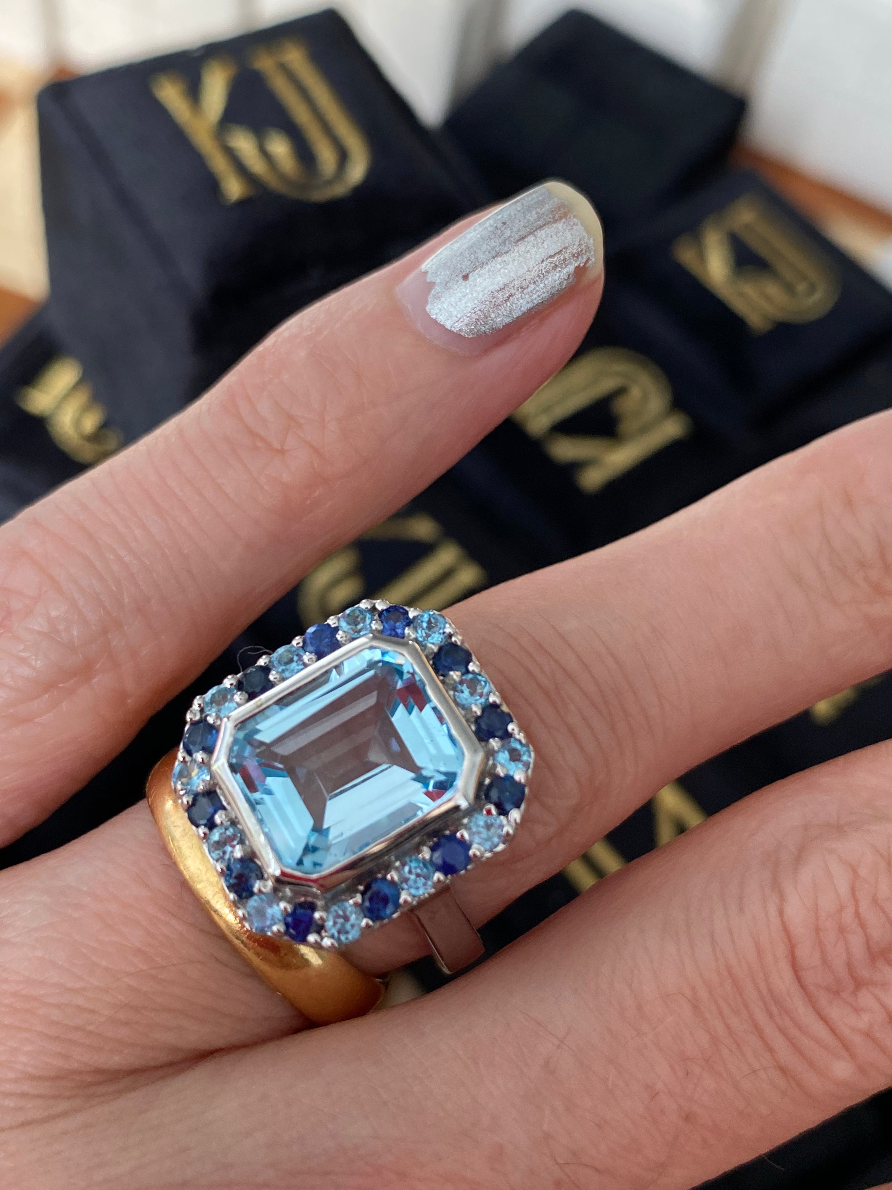 Blue Topaz and Blue Sapphire Halo Cocktail Ring in Sterling Silver