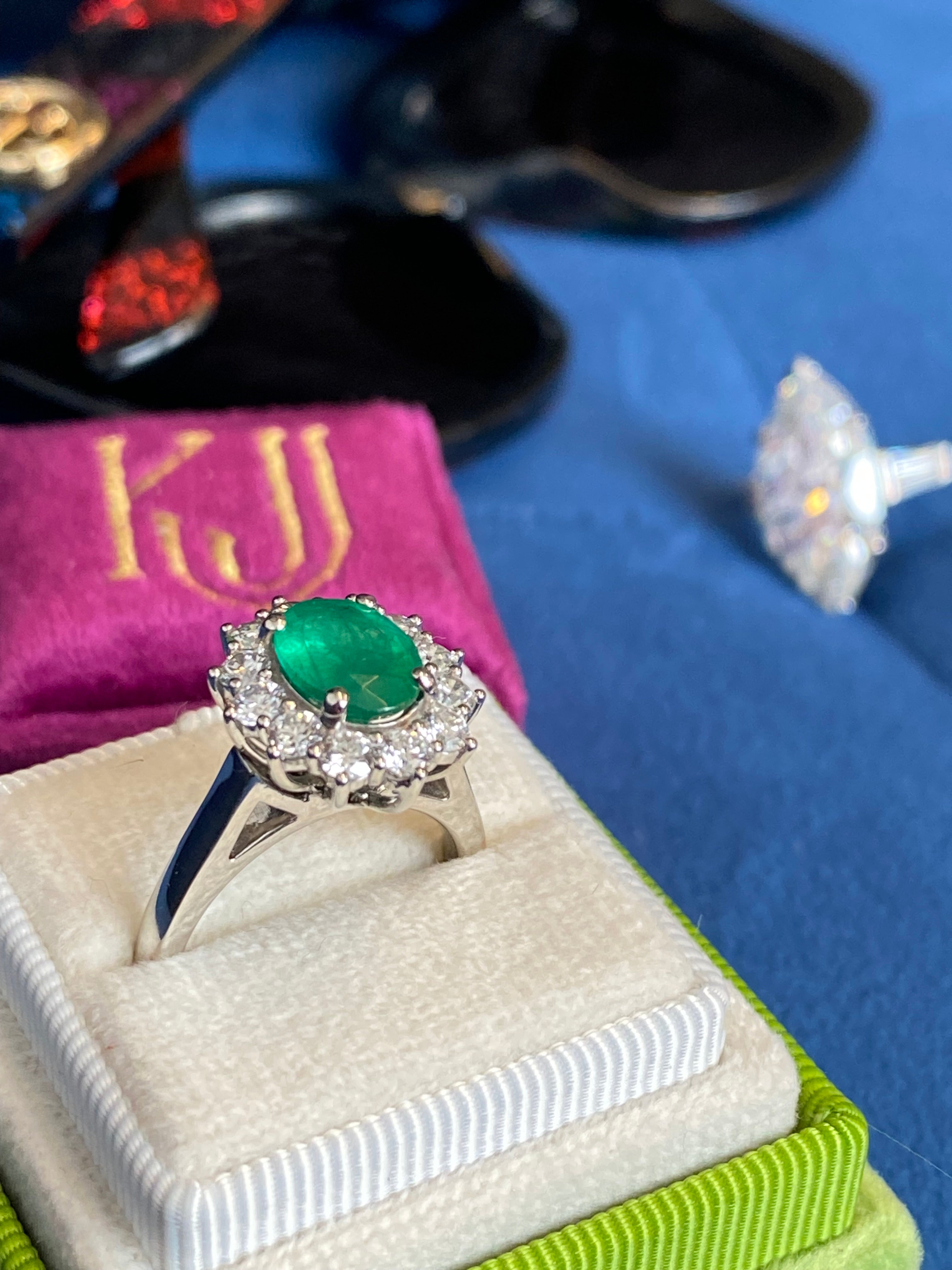 1.53 Carat Cushion Cut Emerald and 0.96 CTW Natural Diamond Halo Ring in Platinum