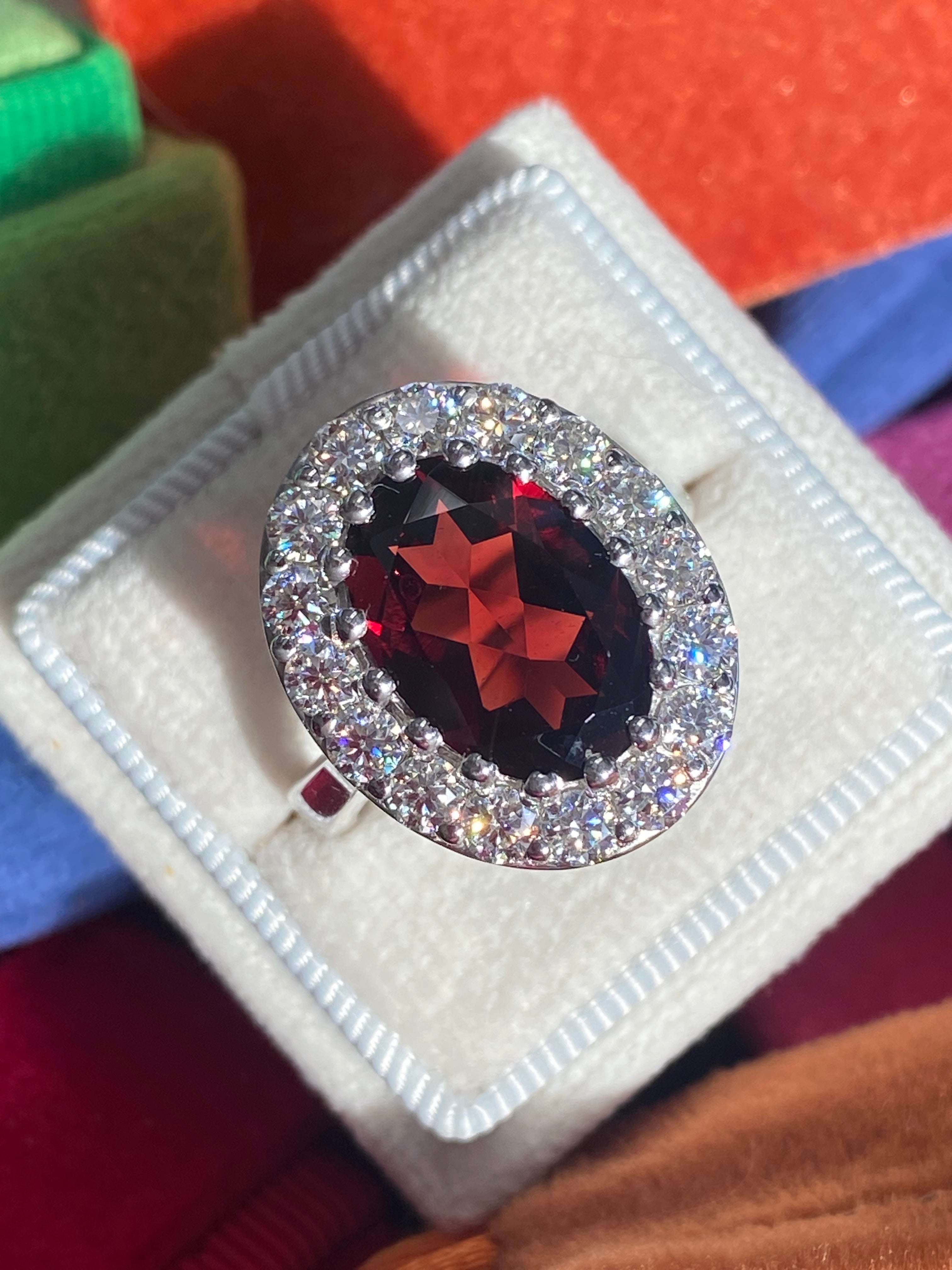 8.25 CTW Oval Cut Garnet and Moissanite Halo Cocktail Ring in Sterling Silver