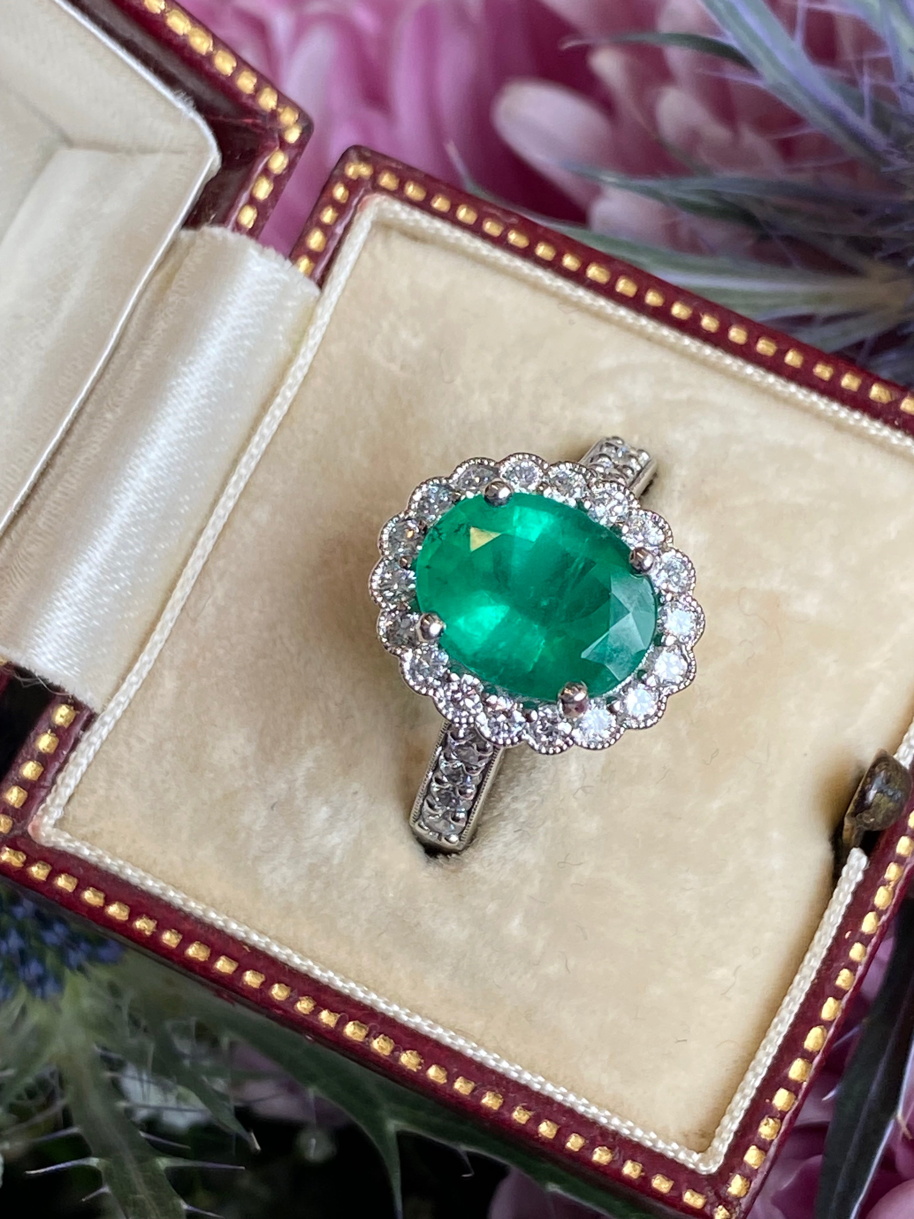 3.12 CTW Oval Cut Emerald and Natural Diamond Halo Ring in Platinum