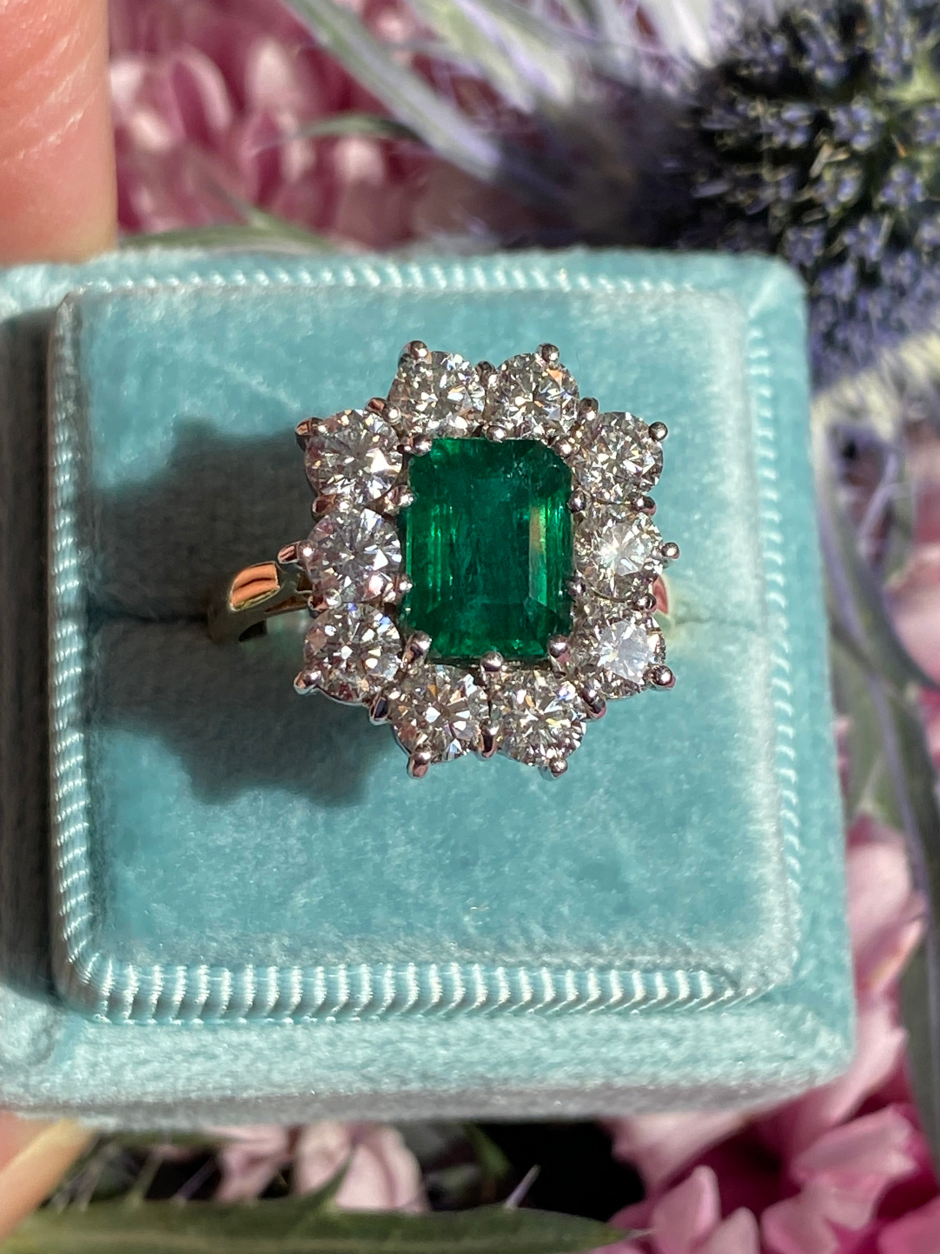 Outrageously Fantastic 4.17 CTW Emerald and Diamond Halo Ring in 18ct White and Yellow Gold