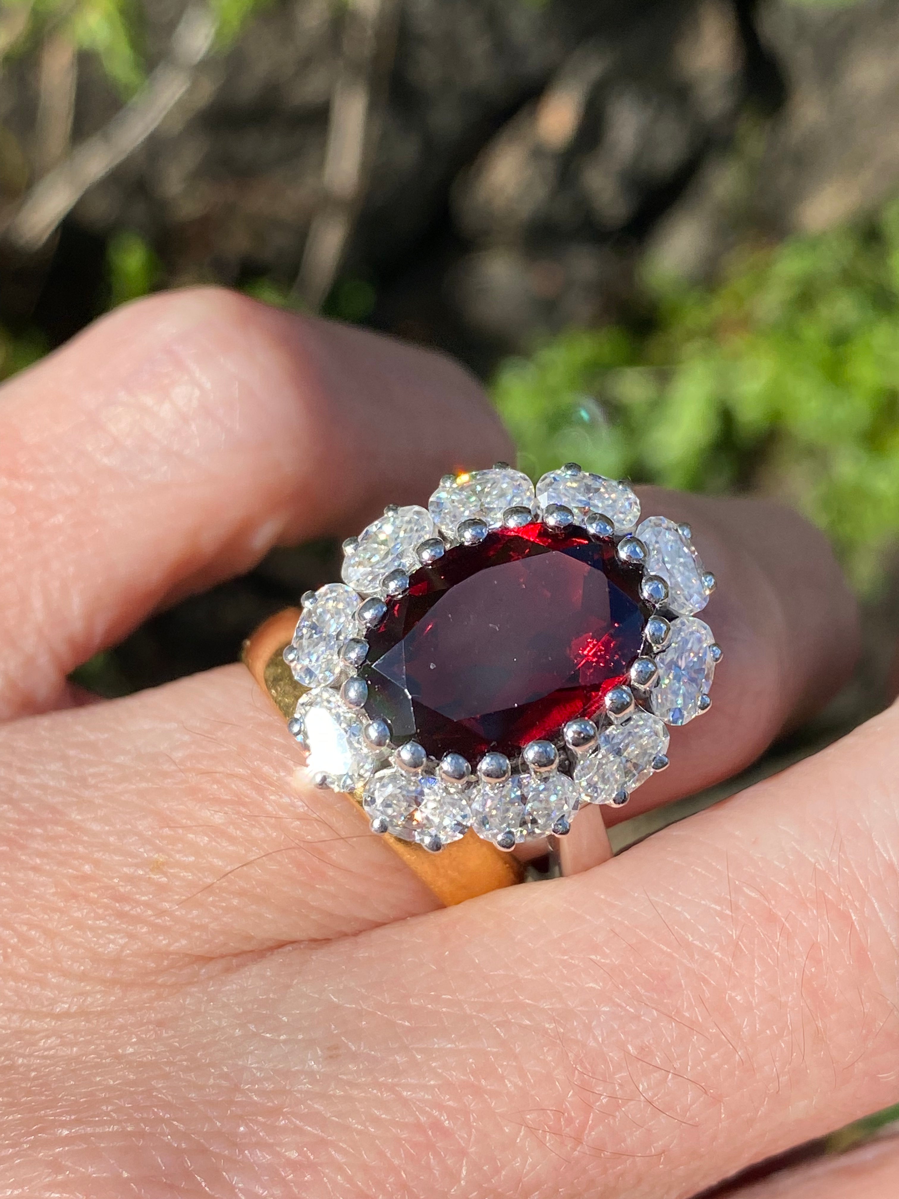 8.17 CTW Oval Cut Garnet and Moissanite Halo Cocktail Ring