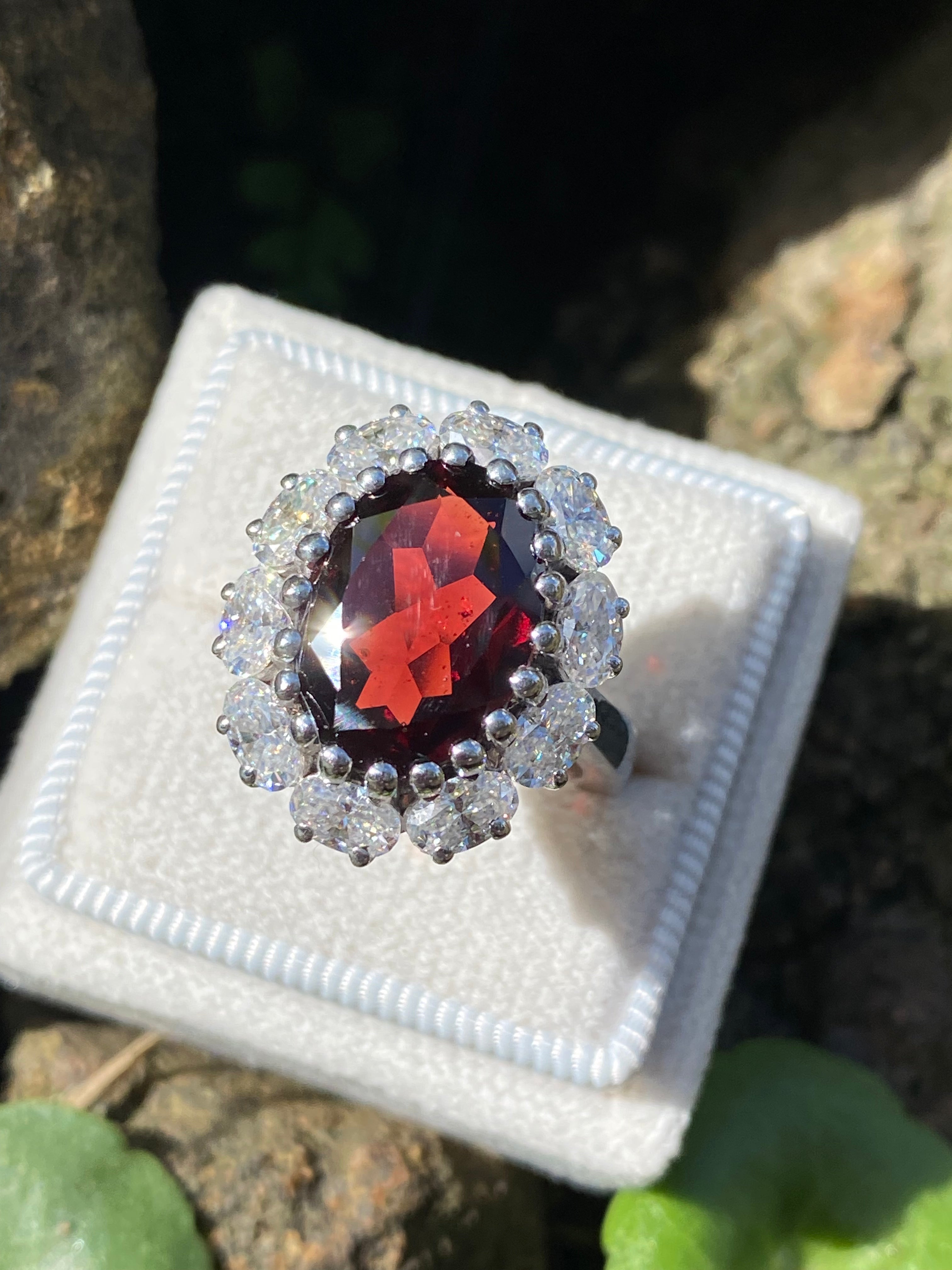 8.17 CTW Oval Cut Garnet and Moissanite Halo Cocktail Ring