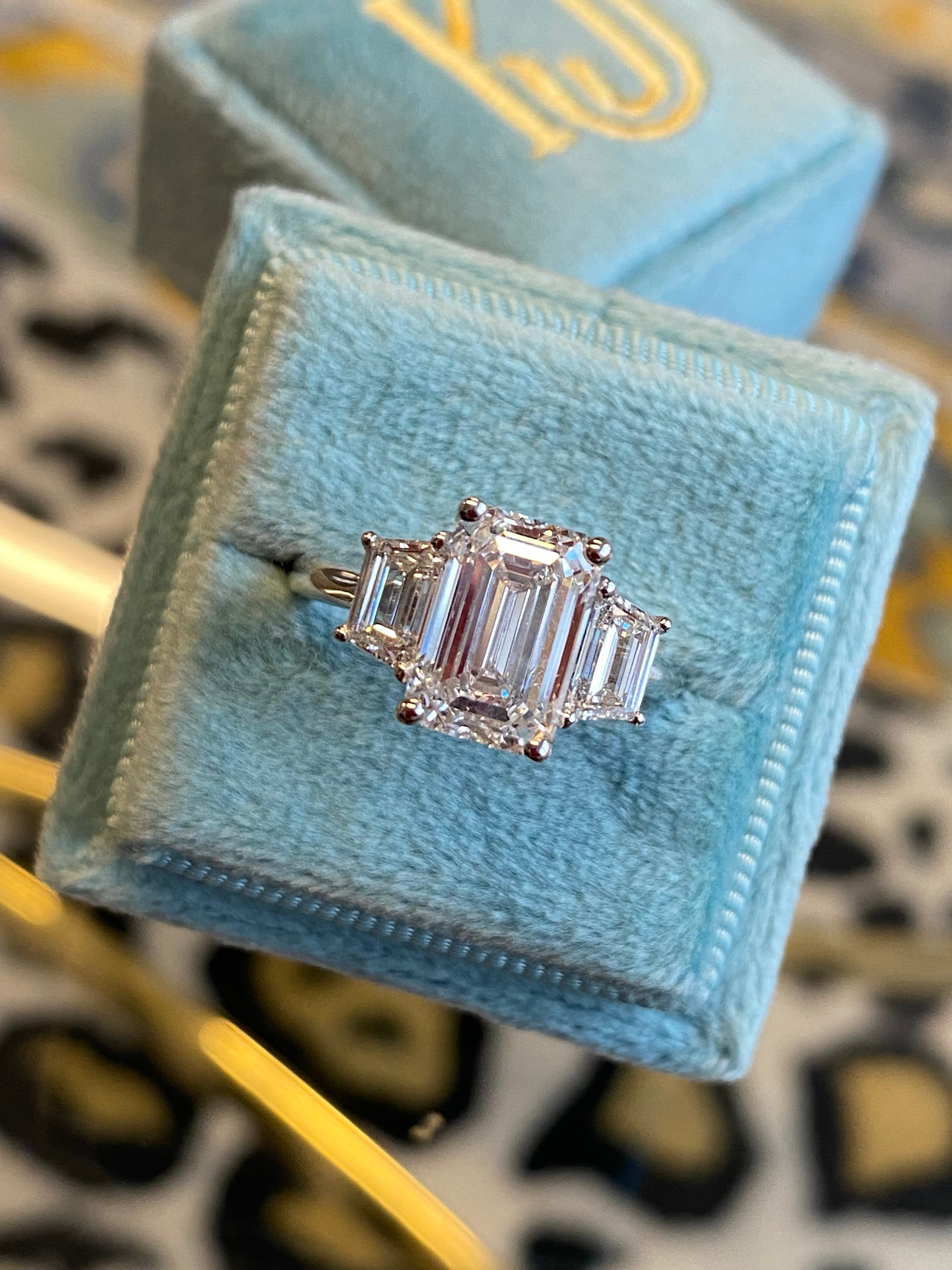 3.93 CTW Emerald and Trapezoid Cut D Colour VS1 Lab Diamond Three Stone Ring in Platinum