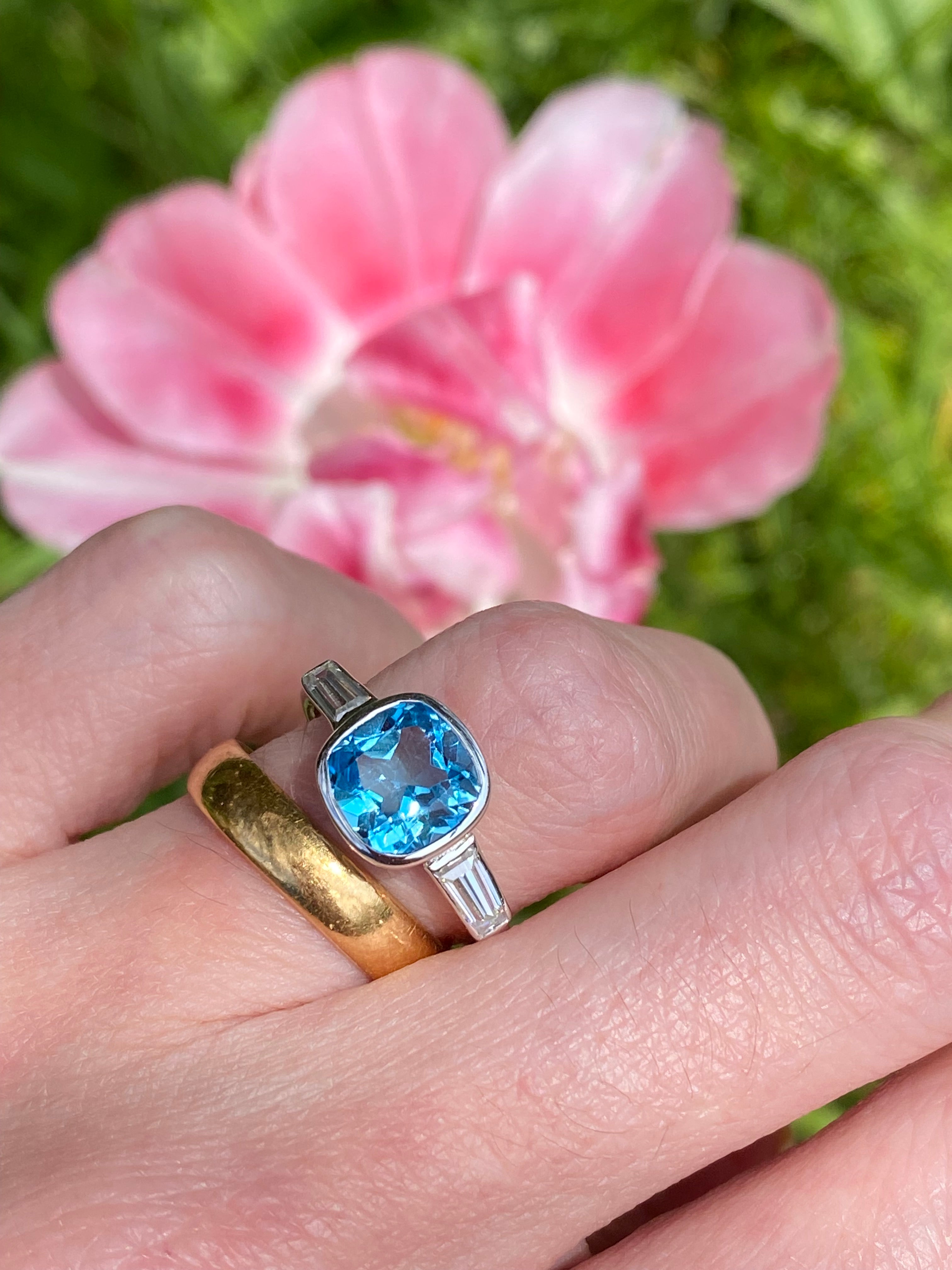 2.33 Carat Cushion Cut Blue Topaz and Moissanite Three Stone Ring in Sterling Silver