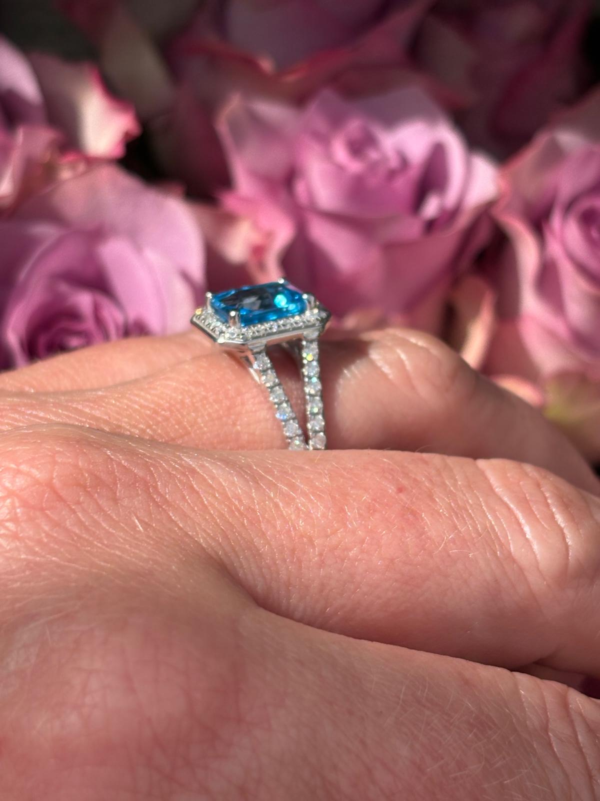 3.10 CTW Emerald Cut Moissanite and Blue Topaz Halo Ring in Sterling Silver
