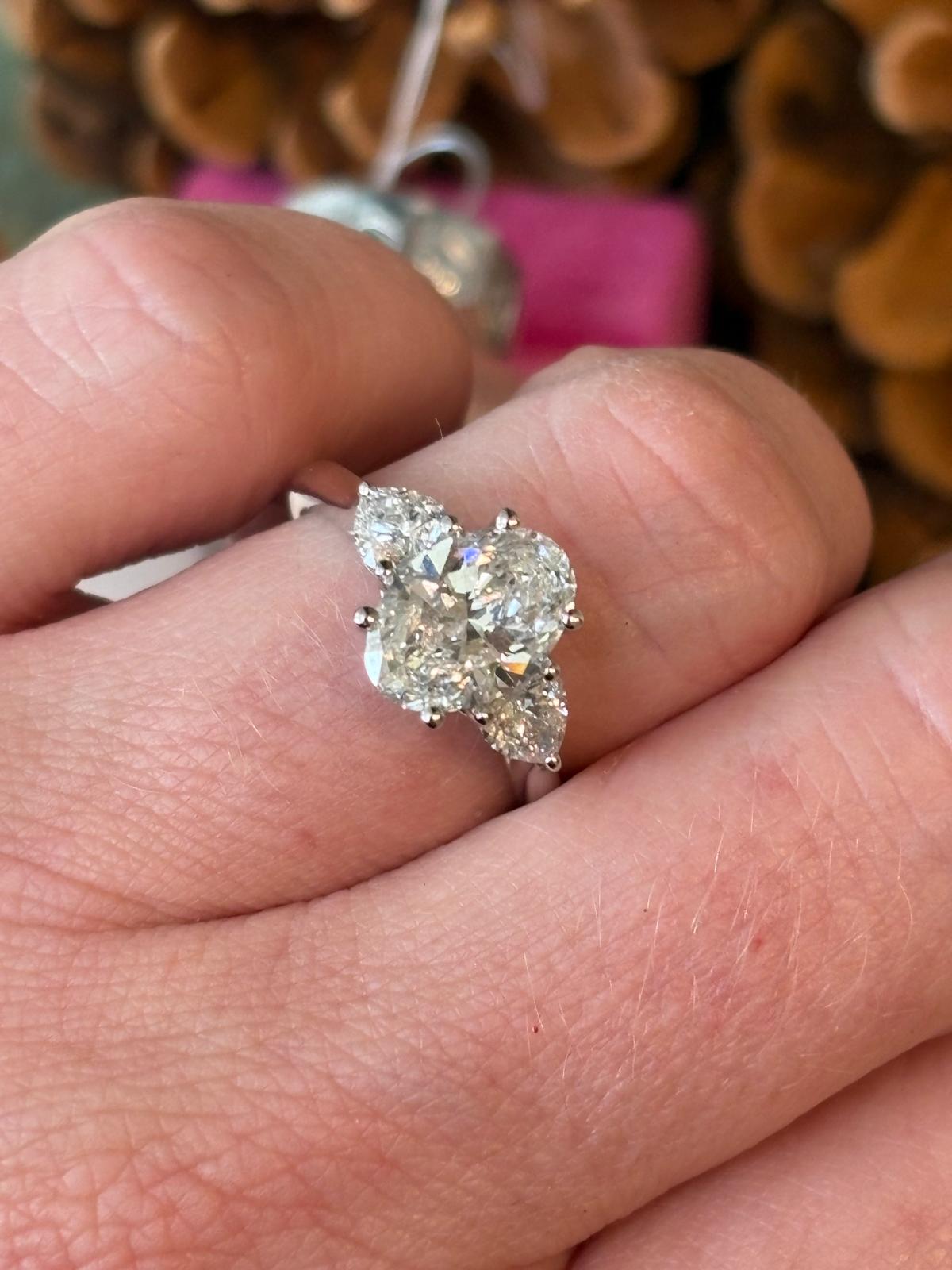 2.61 CTW Oval and Heart Cut D Colour VS2 Lab Diamond Three Stone Ring in Platinum