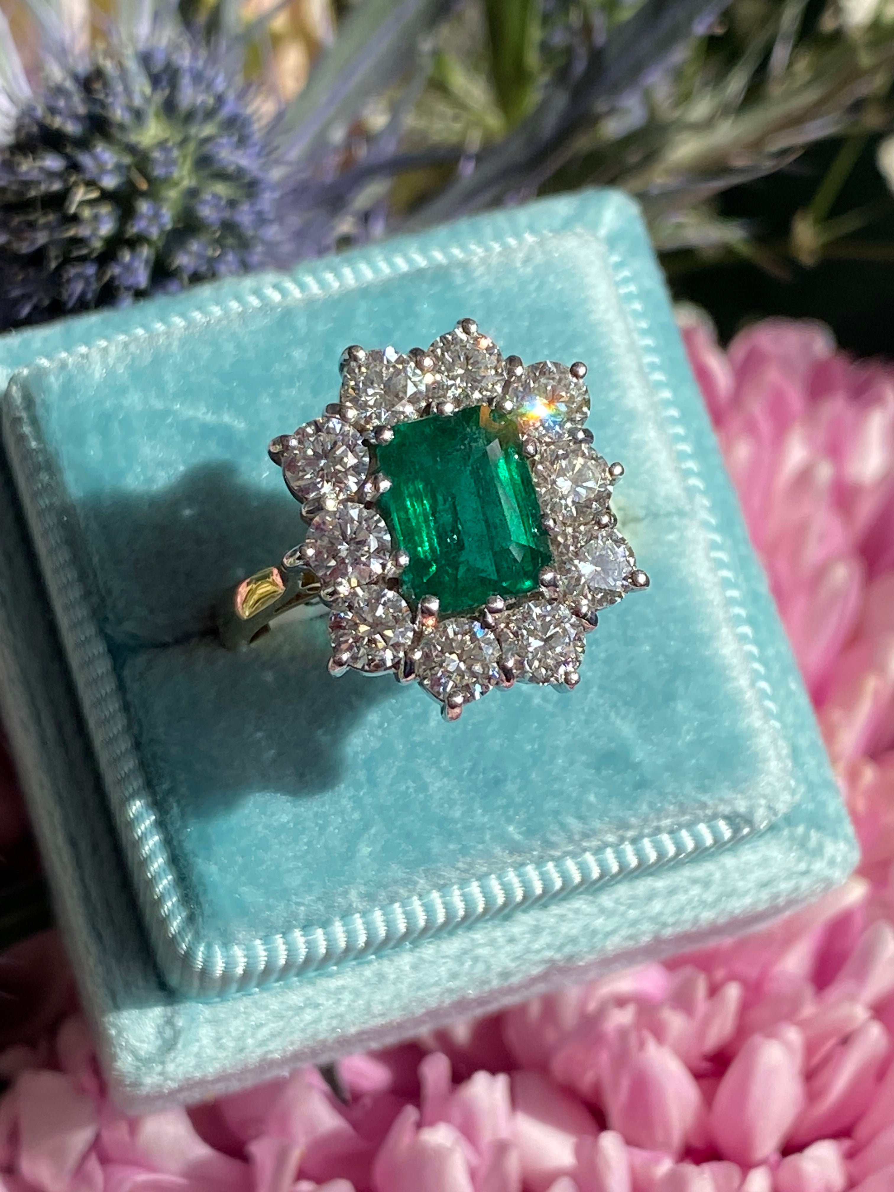 Outrageously Fantastic 4.17 CTW Emerald and Diamond Halo Ring in 18ct White and Yellow Gold