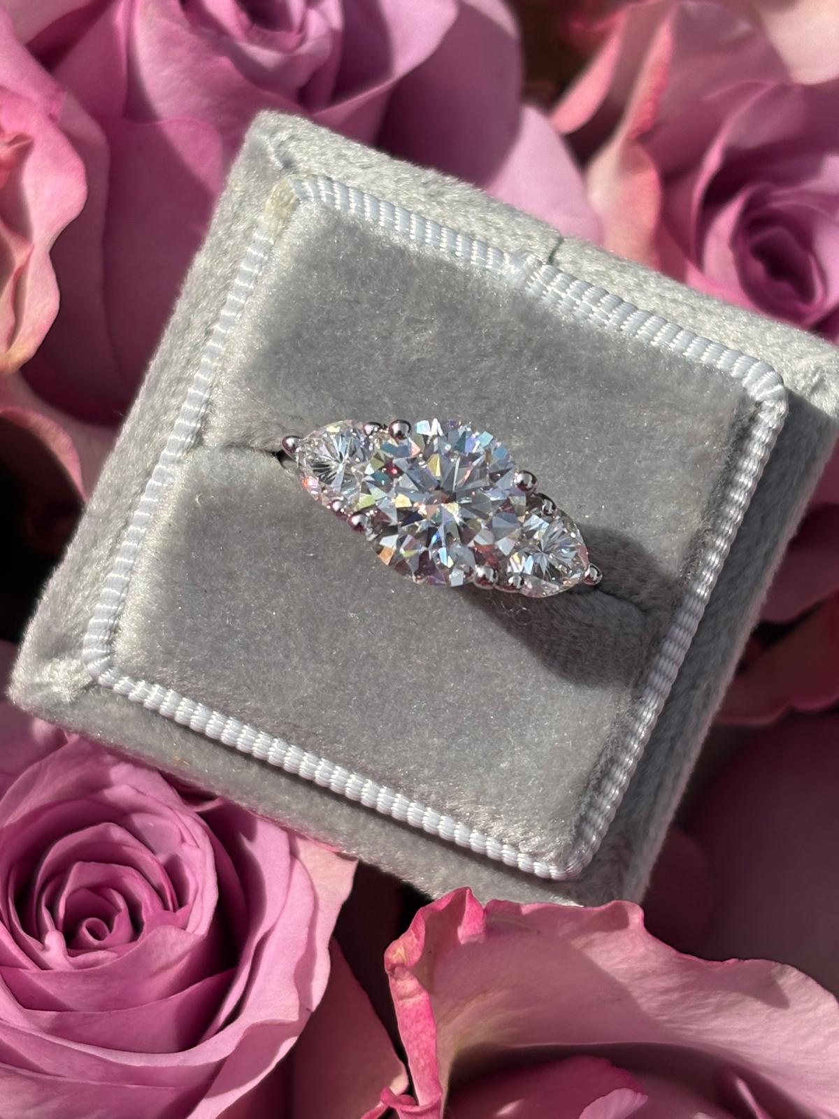 3.40 CTW Round and Heart Shape Moissanite Three Stone Ring in Sterling Silver