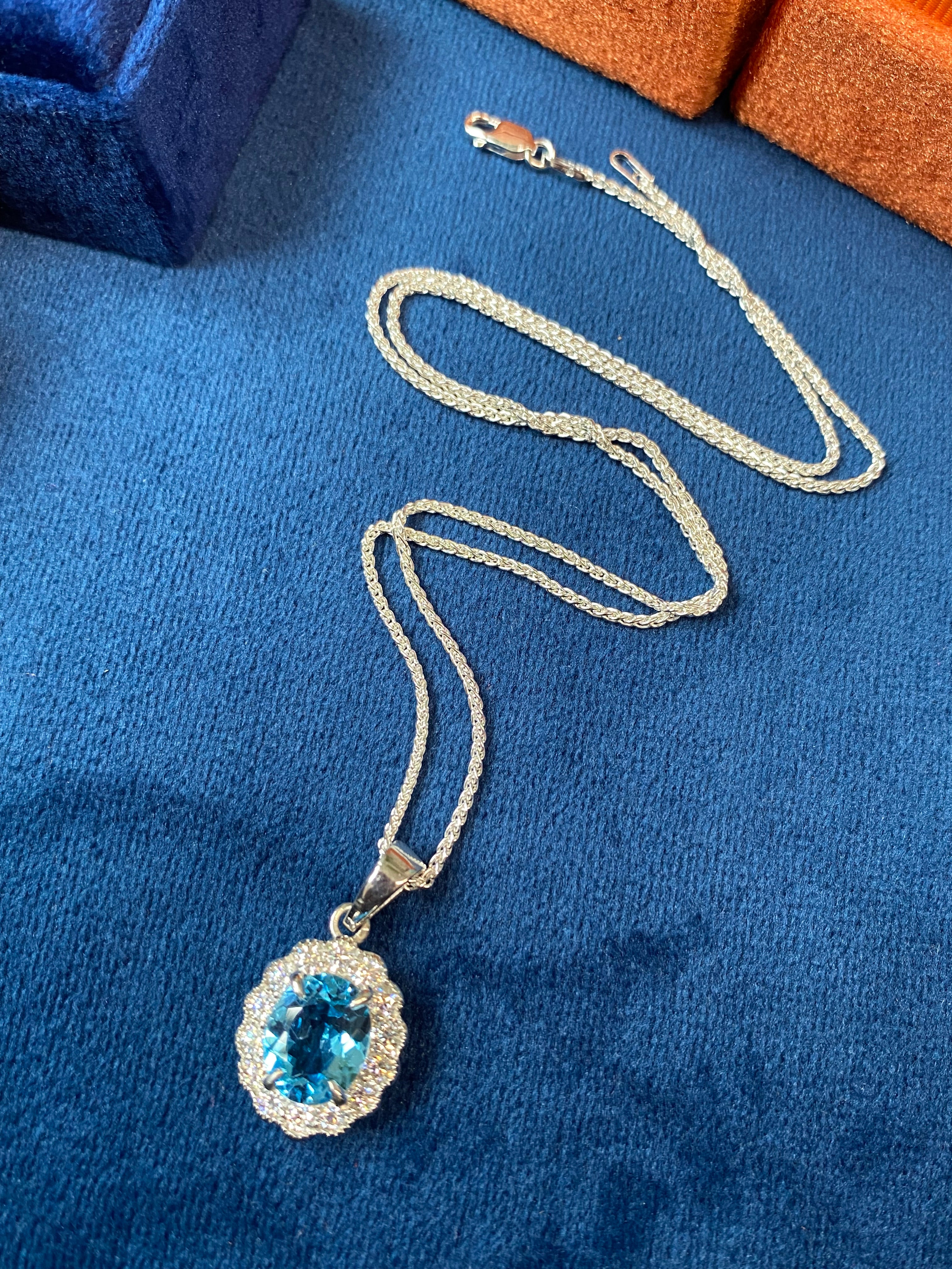 5.00 CTW Blue Topaz and Moissanite Halo Pendant Necklace in Sterling Silver
