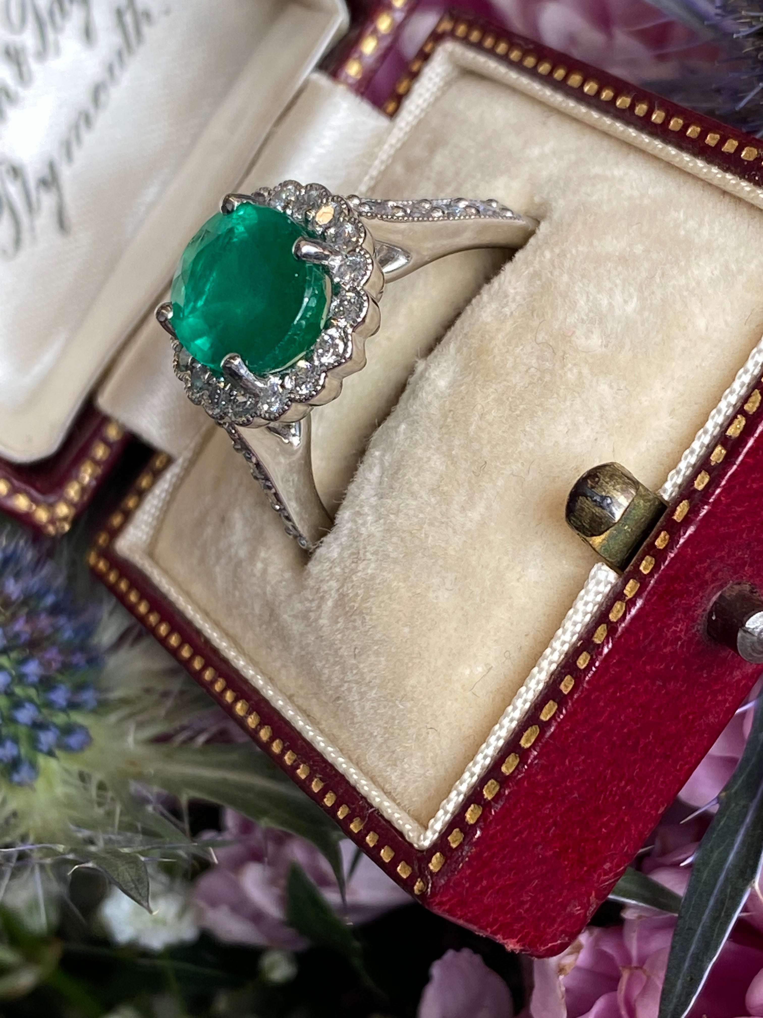 3.12 CTW Oval Cut Emerald and Natural Diamond Halo Ring in Platinum