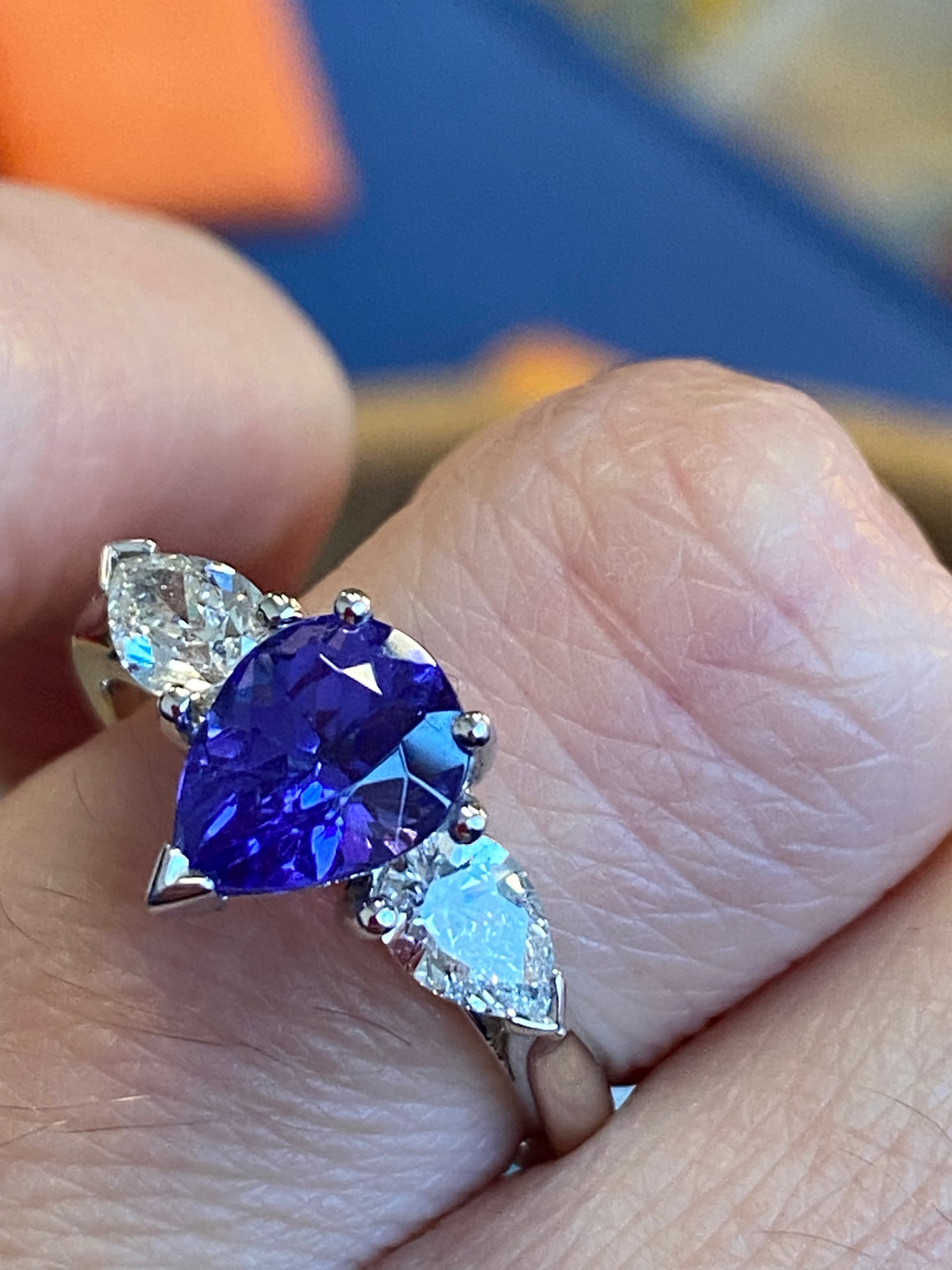 2.47 CTW Pear Cut Tanzanite and Natural Diamond Three Stone Ring in Platinum
