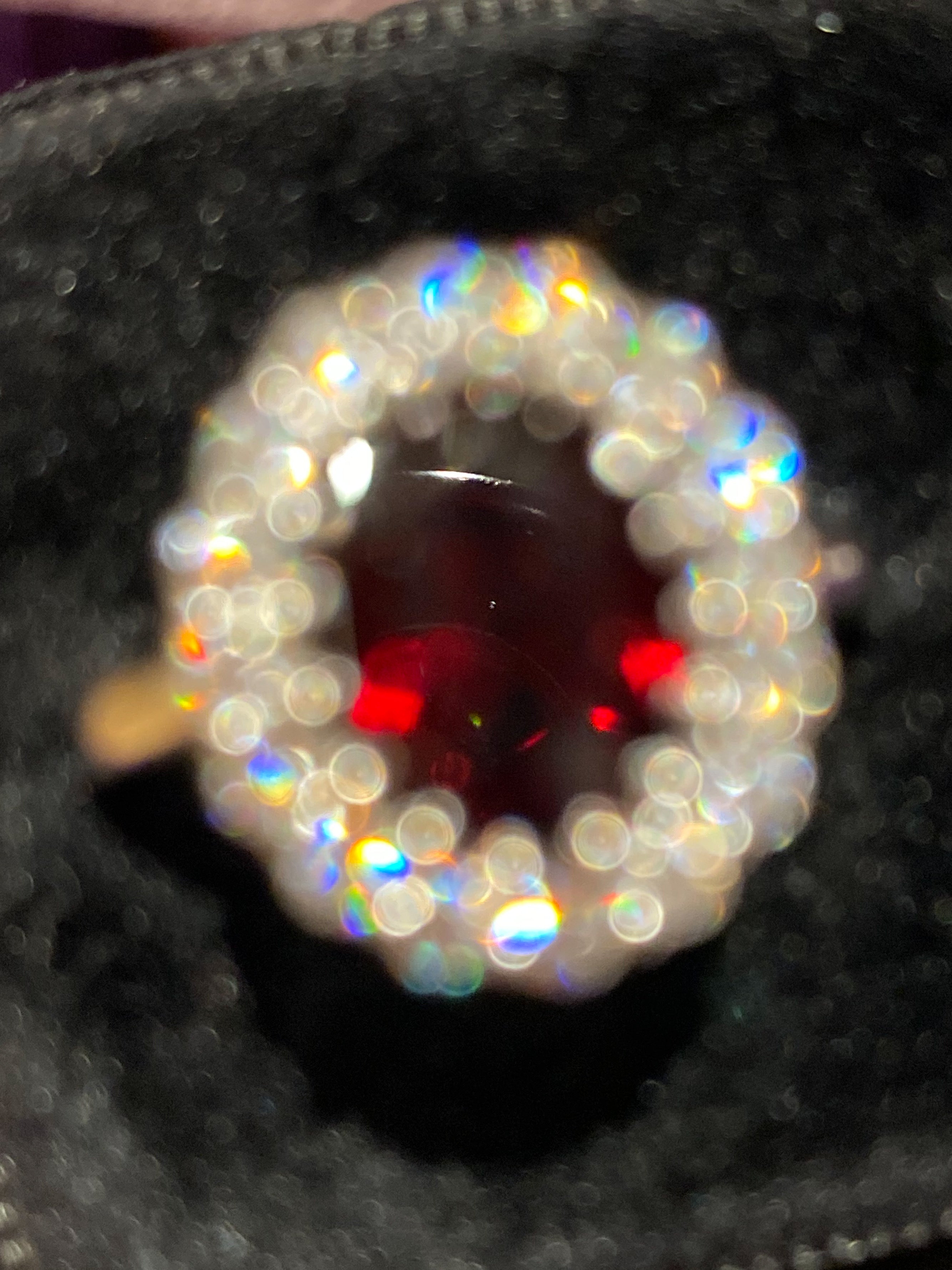 2.33 CTW Oval Cut Garnet and Moissanite Halo Ring in Sterling Silver