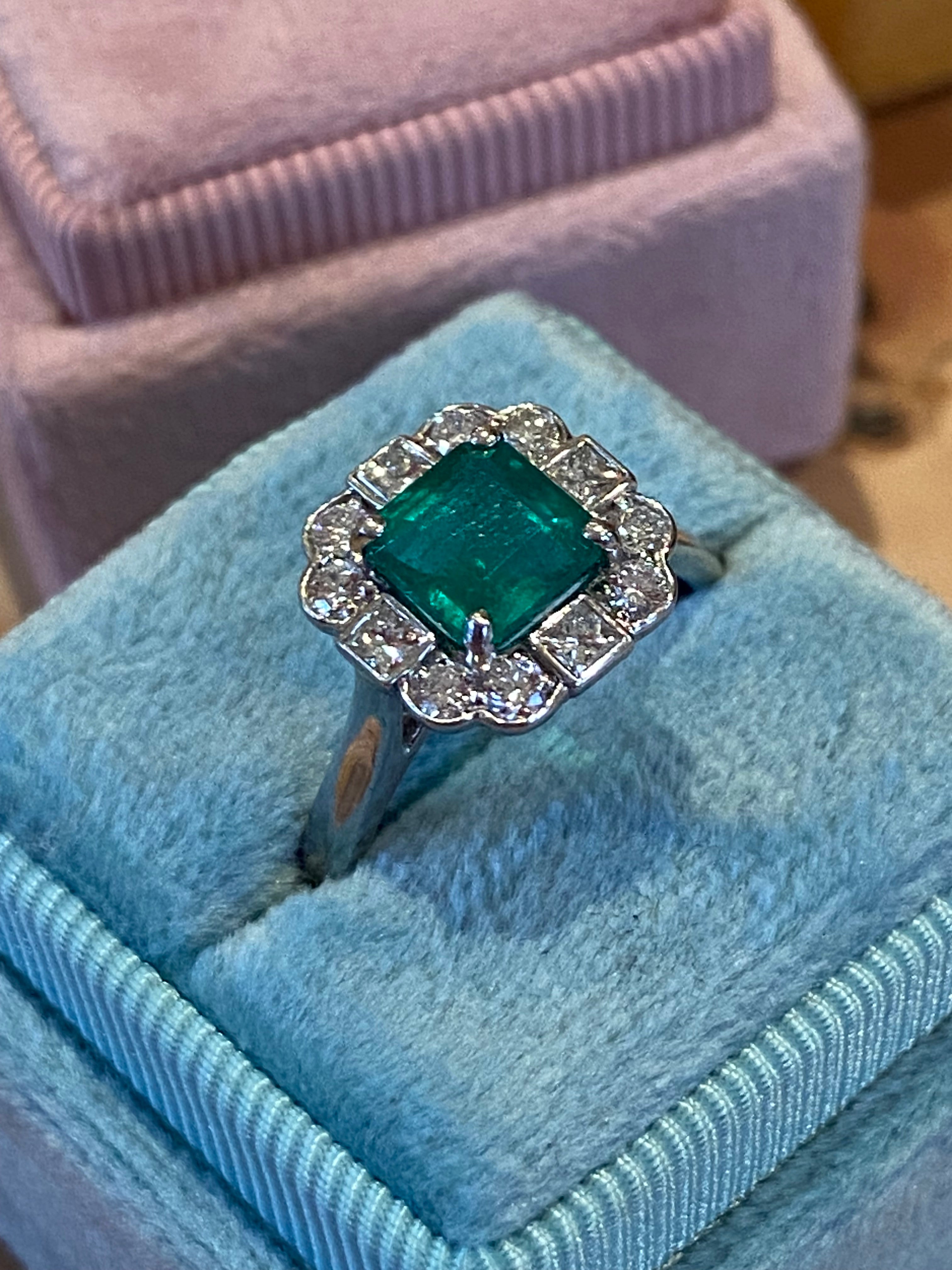 1.35 Carat Emerald Cut Emerald and 0.49 CTW Natural Diamond Halo Ring in Platinum