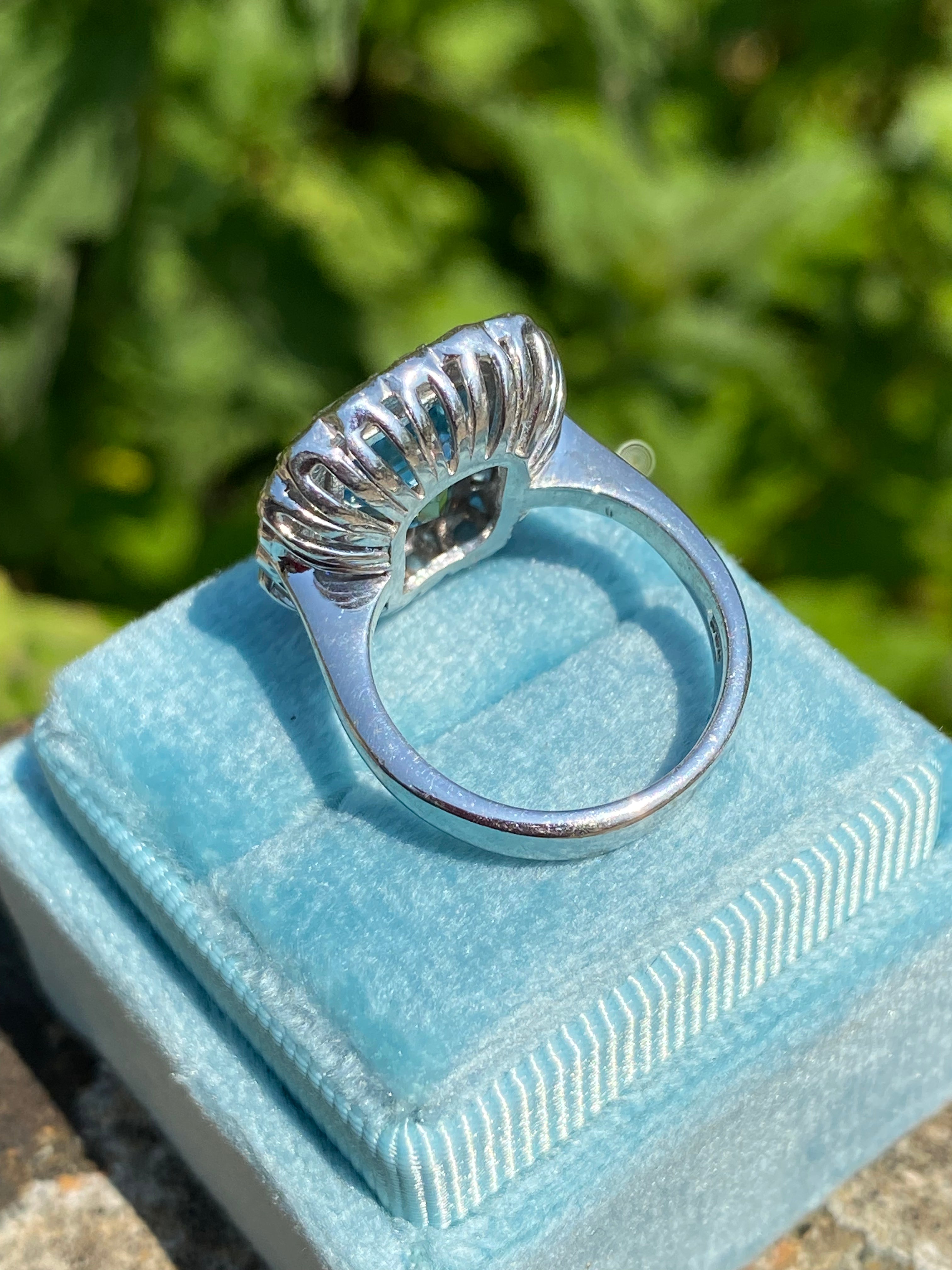 4.25 CTW Emerald Cut Blue Topaz and Moissanite Halo Cocktail Ring