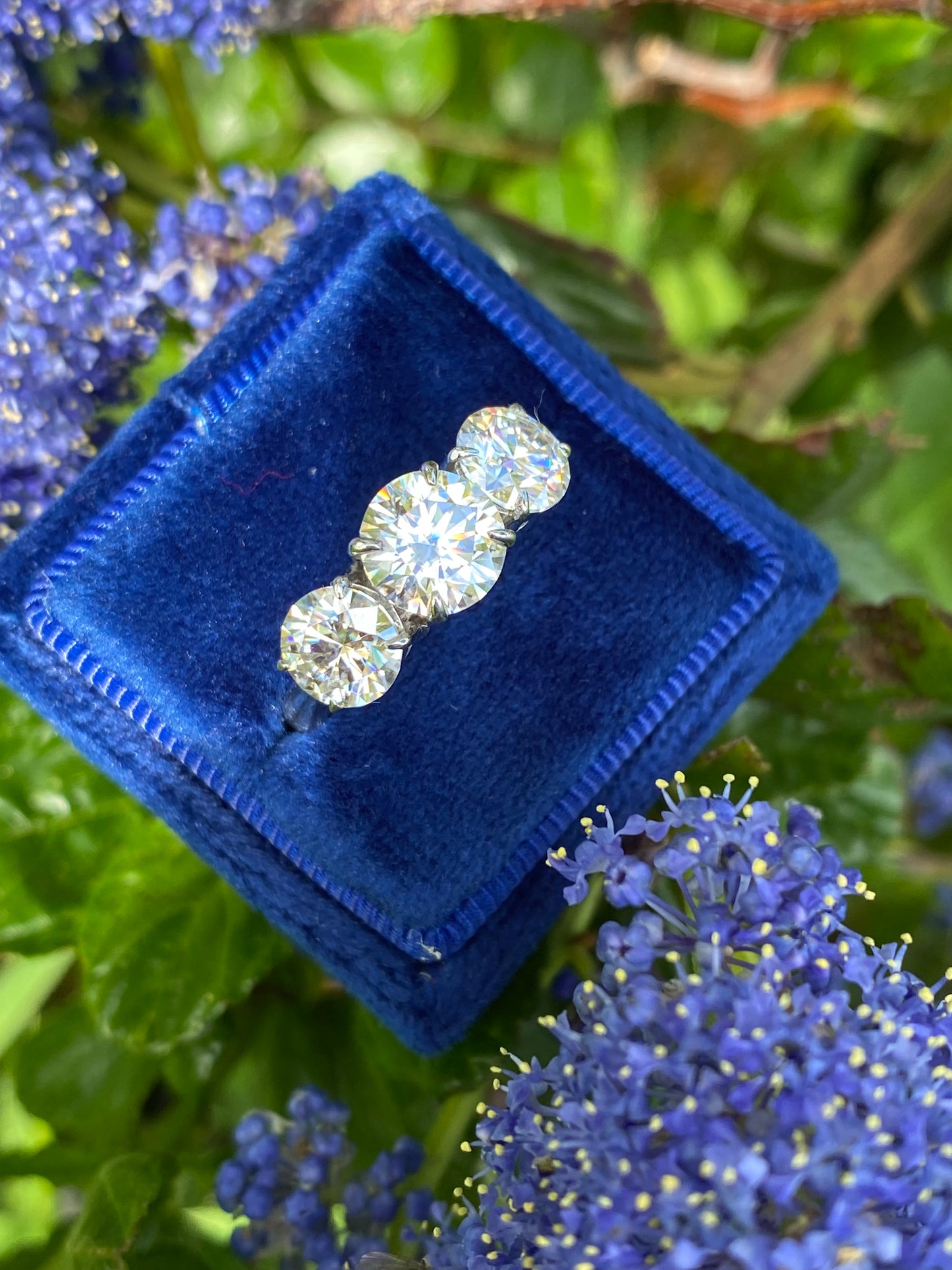 Three stone emerald cut moissanite ring discount