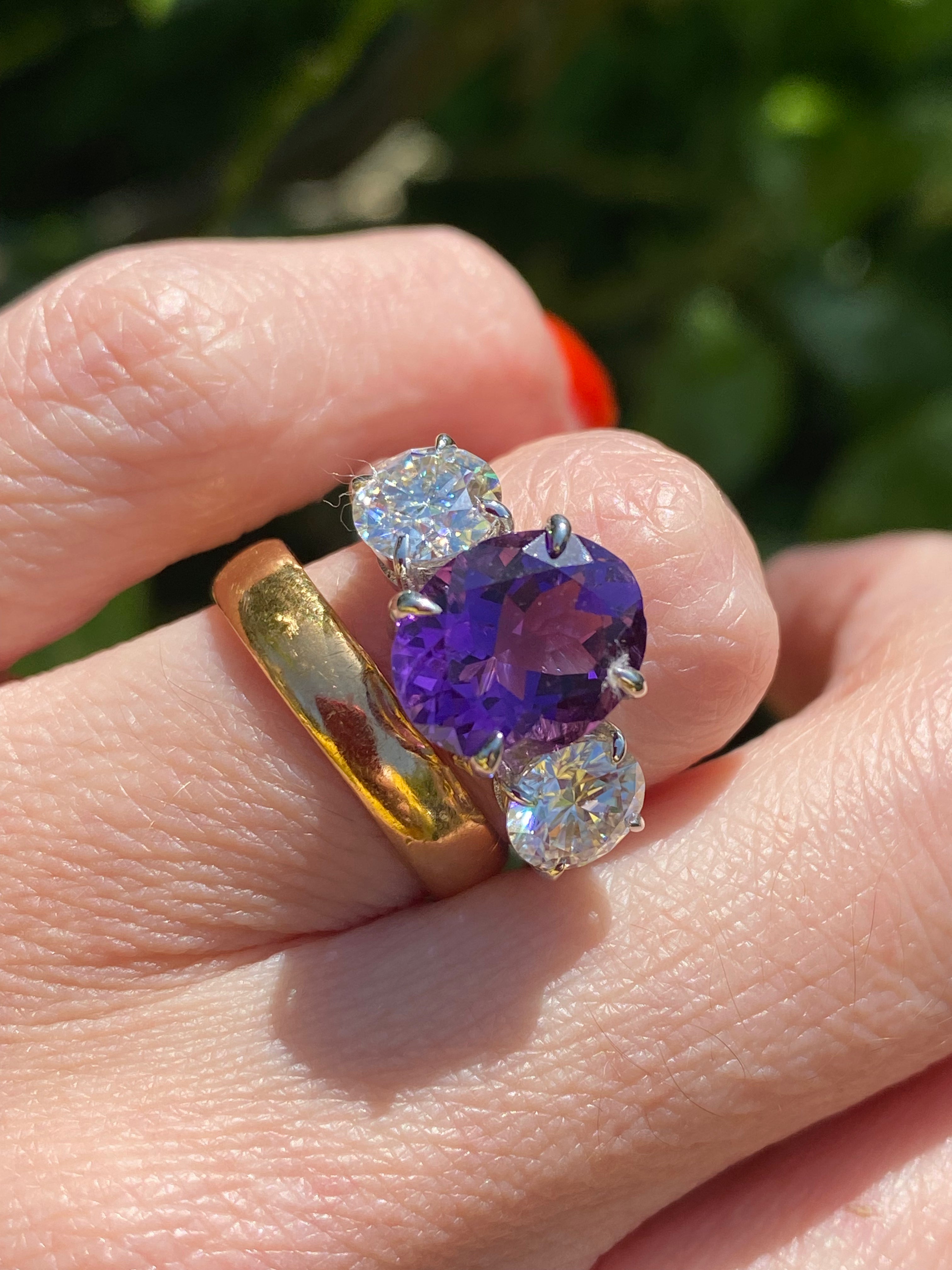3.42 Carat Oval Cut Amethyst and 1.85 Carat Moissanite Three Stone Ring in Sterling Silver