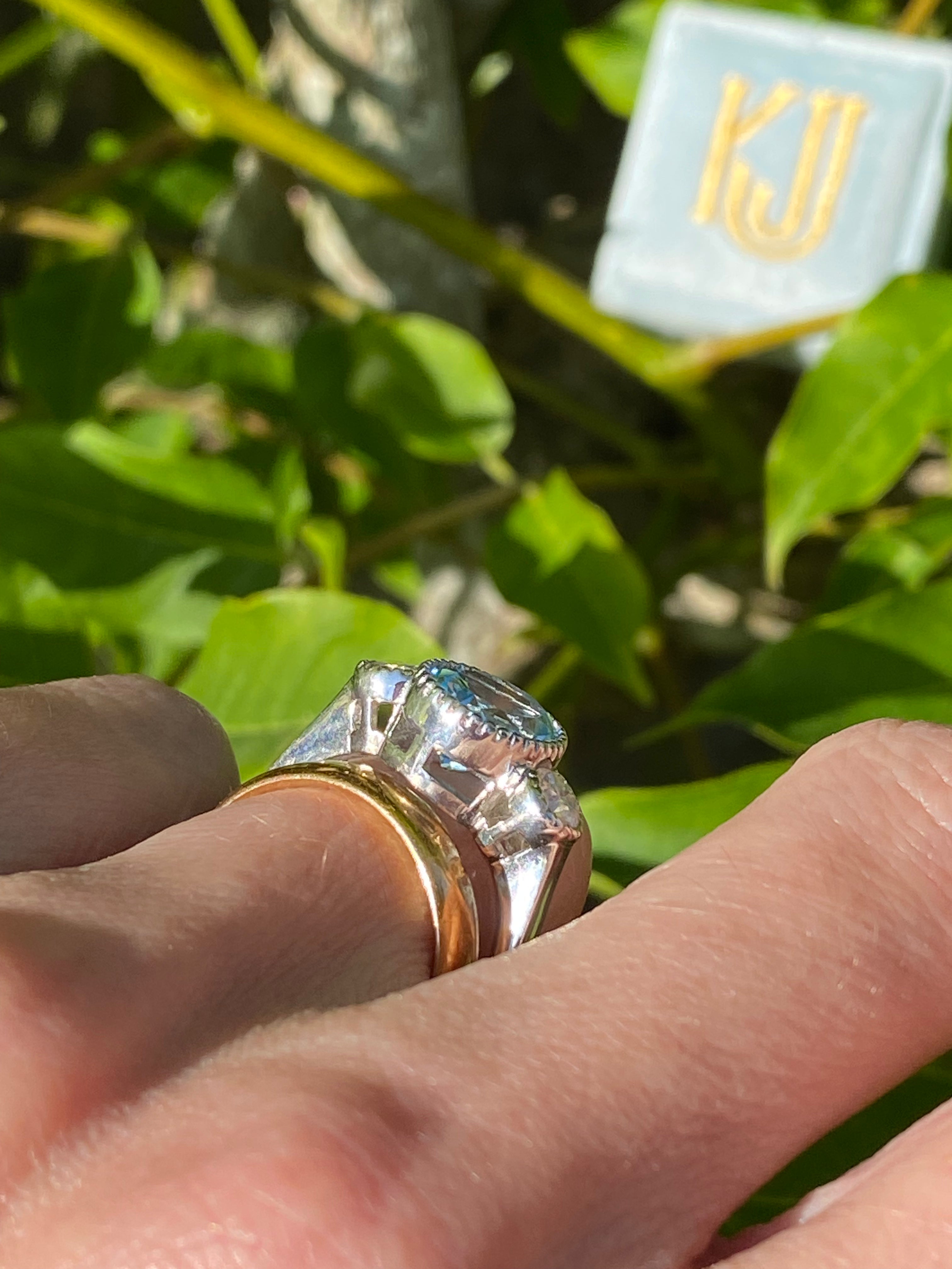 3.34 Carat Oval Cut Blue Topaz and Moissanite Three Stone Ring in Sterling Silver