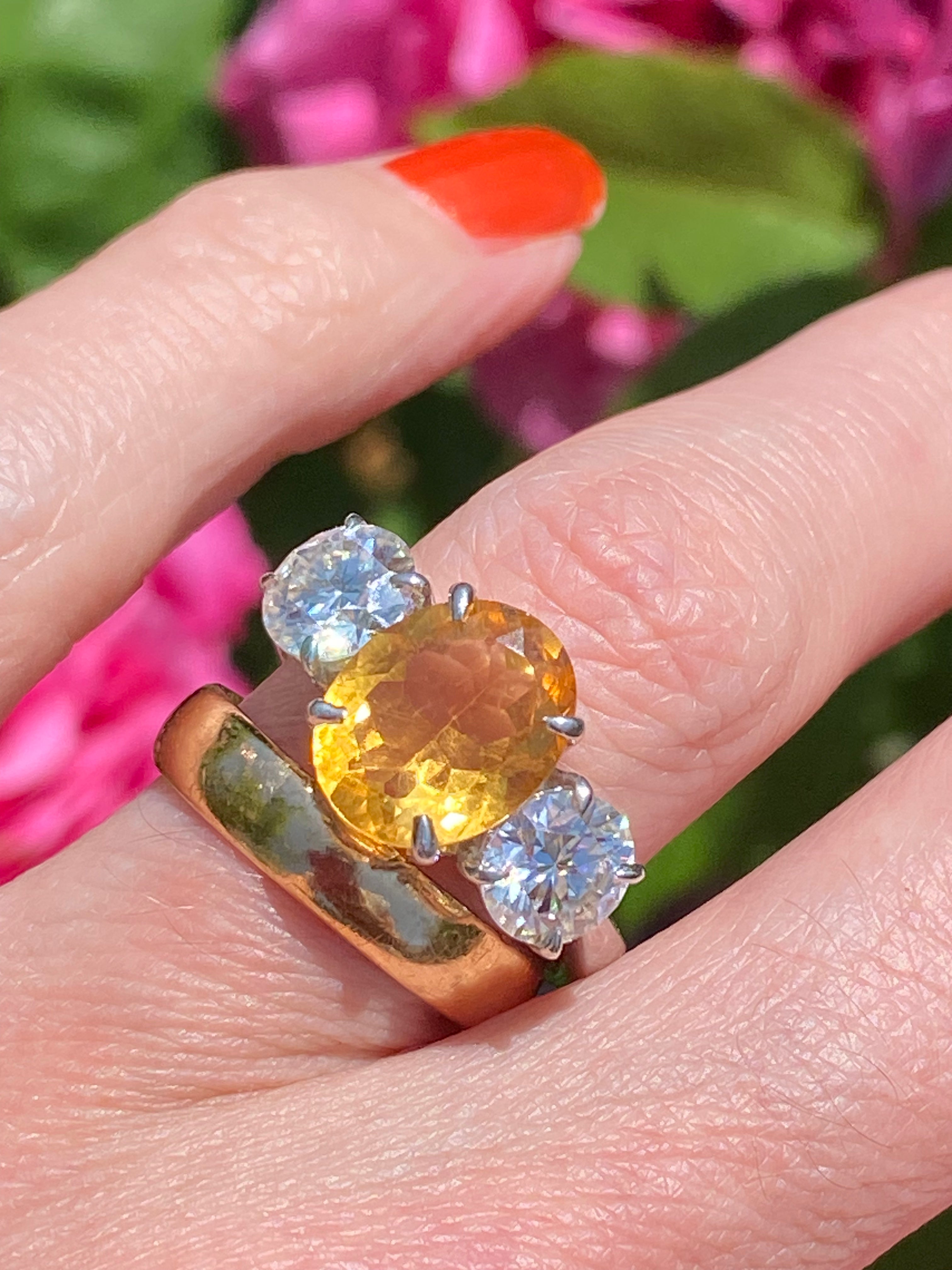 2.66 Carat Oval Cut Citrine and 1.85 Carat Moissanite Three Stone Ring in Sterling Silver