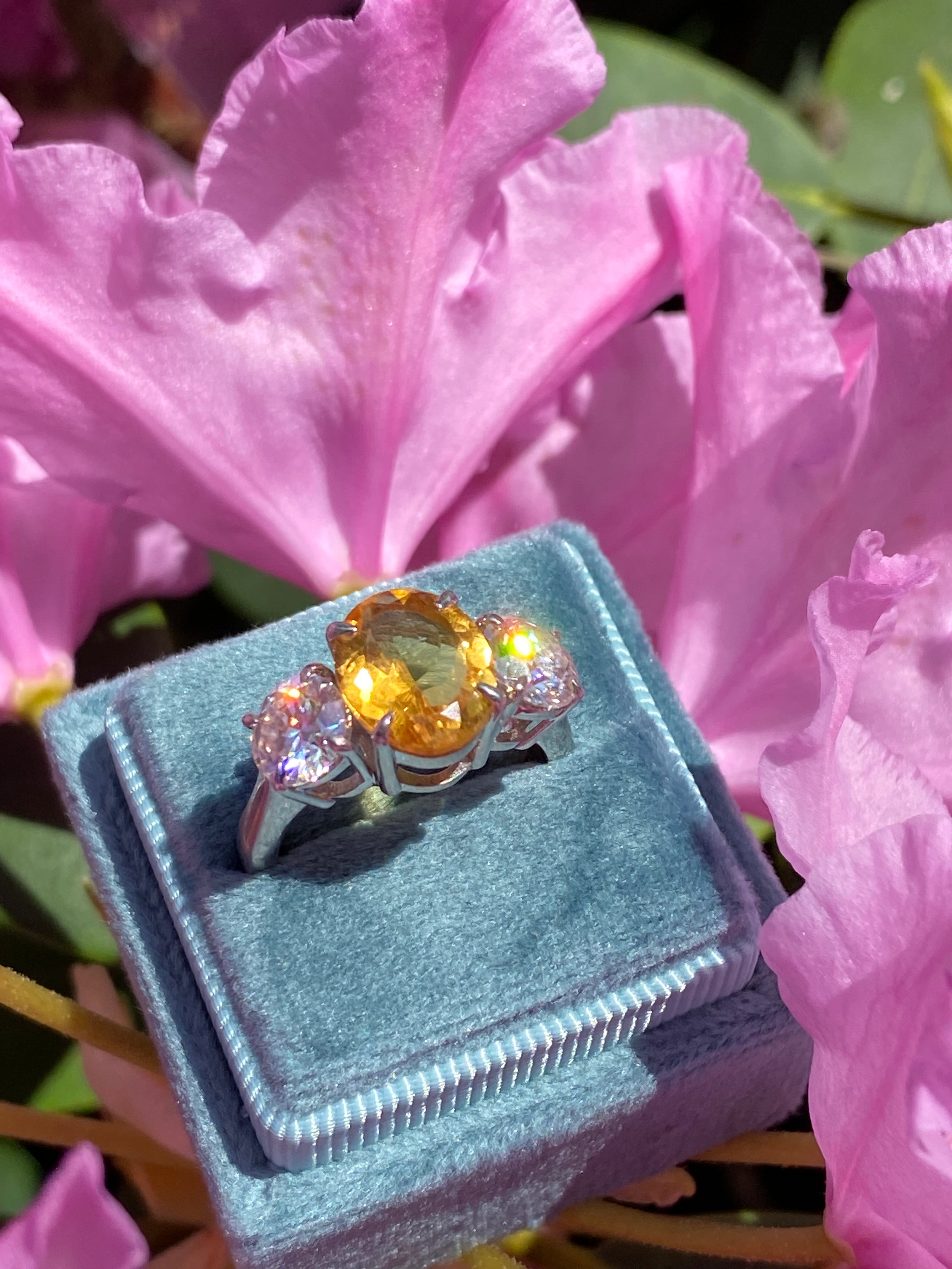 2.66 Carat Oval Cut Citrine and 1.85 Carat Moissanite Three Stone Ring in Sterling Silver