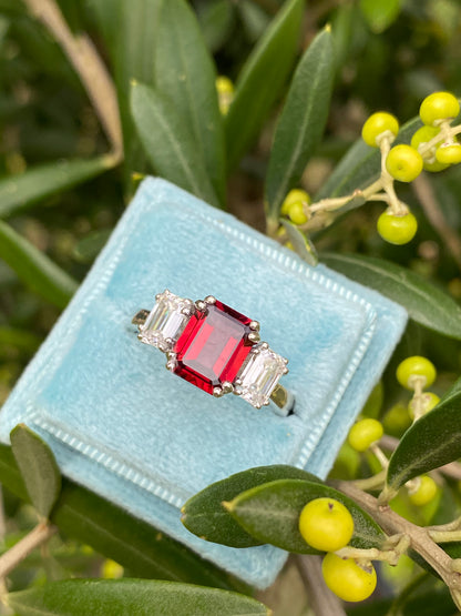 3.50 CTW Emerald Cut Garnet and Moissanite Three Stone Ring in Sterling Silver
