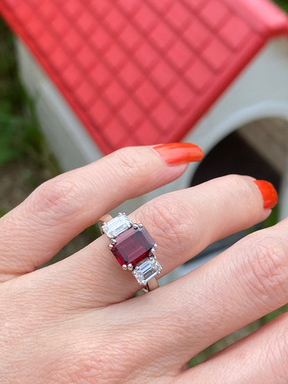 3.50 CTW Emerald Cut Garnet and Moissanite Three Stone Ring in Sterling Silver