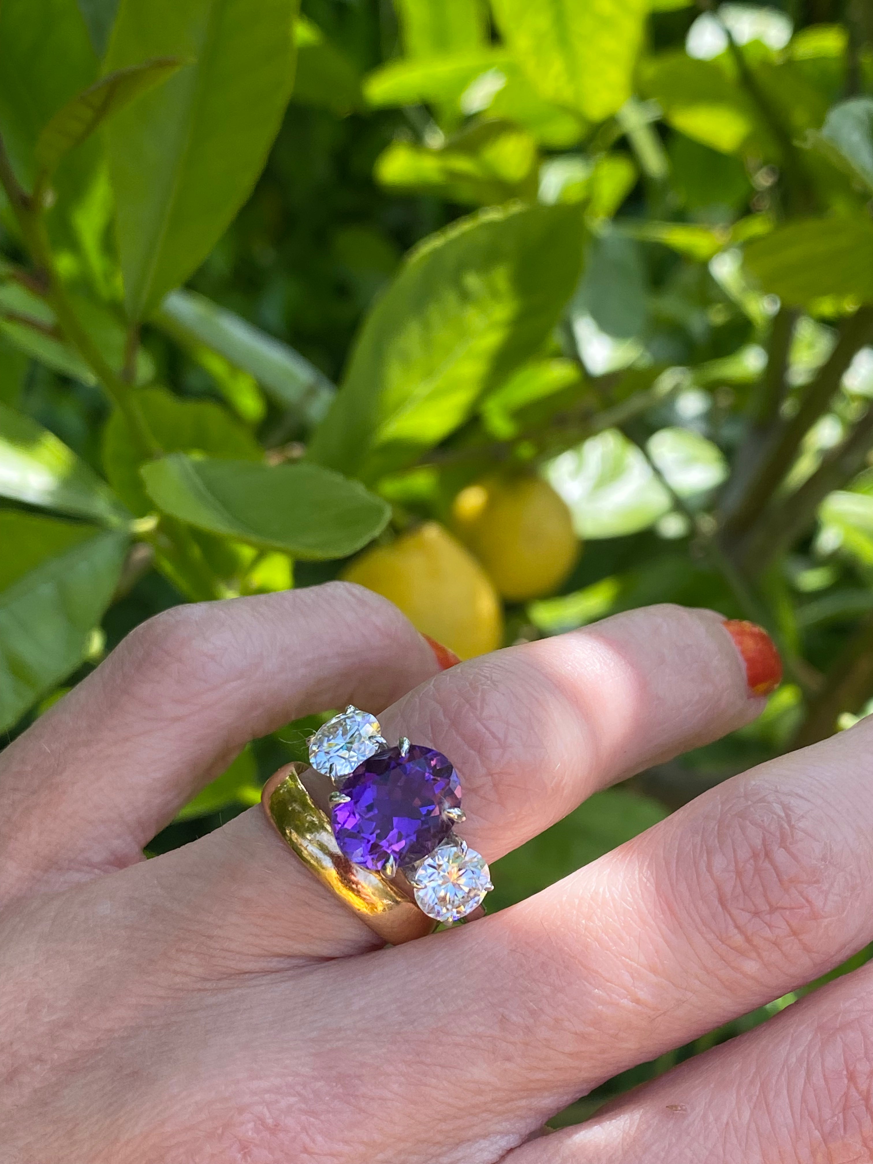 3.42 Carat Oval Cut Amethyst and 1.85 Carat Moissanite Three Stone Ring in Sterling Silver
