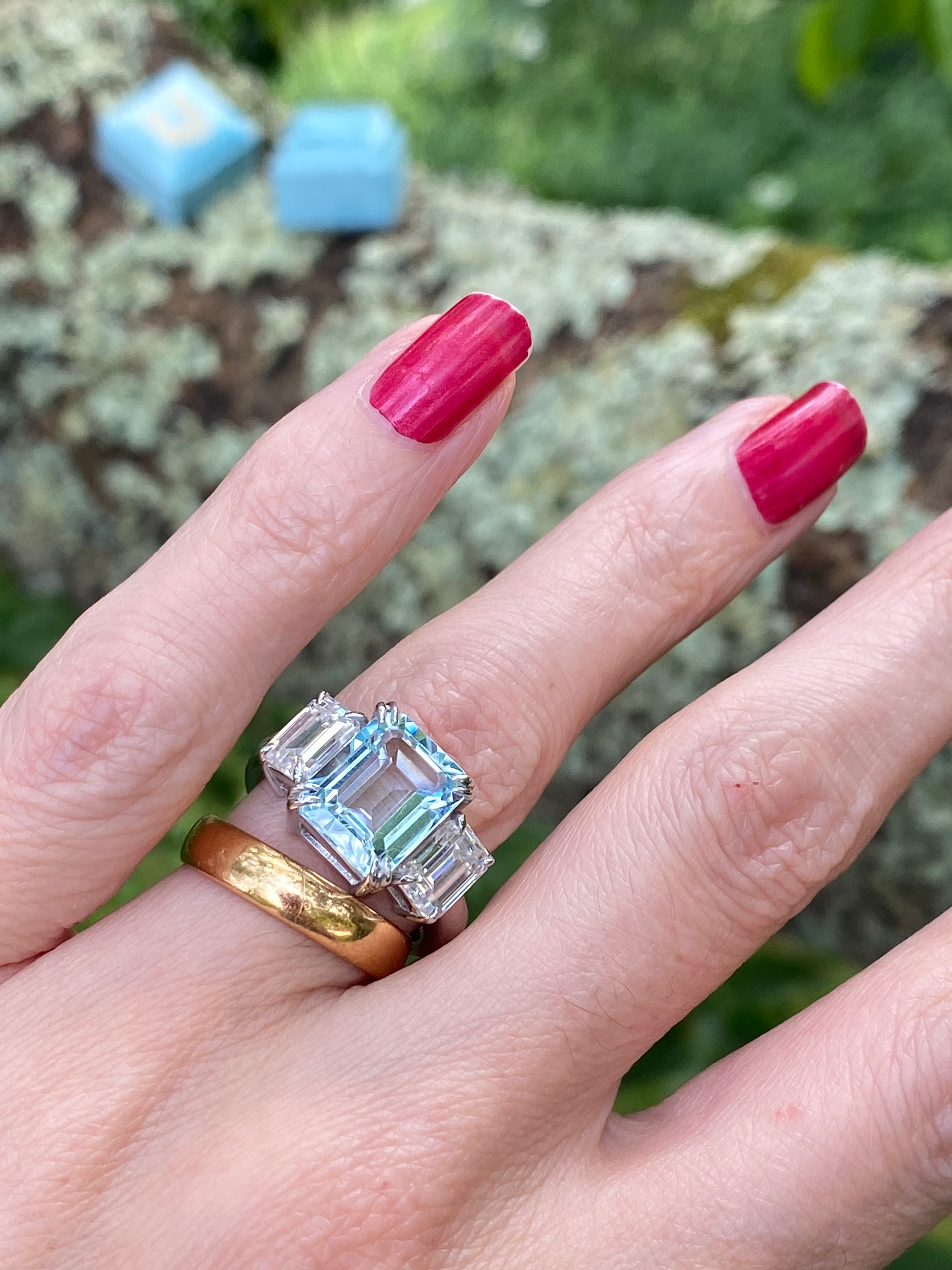 5.71 Carat Emerald Cut Blue Topaz and 2.00 Carat Moissanite Three Stone Ring in Sterling Silver