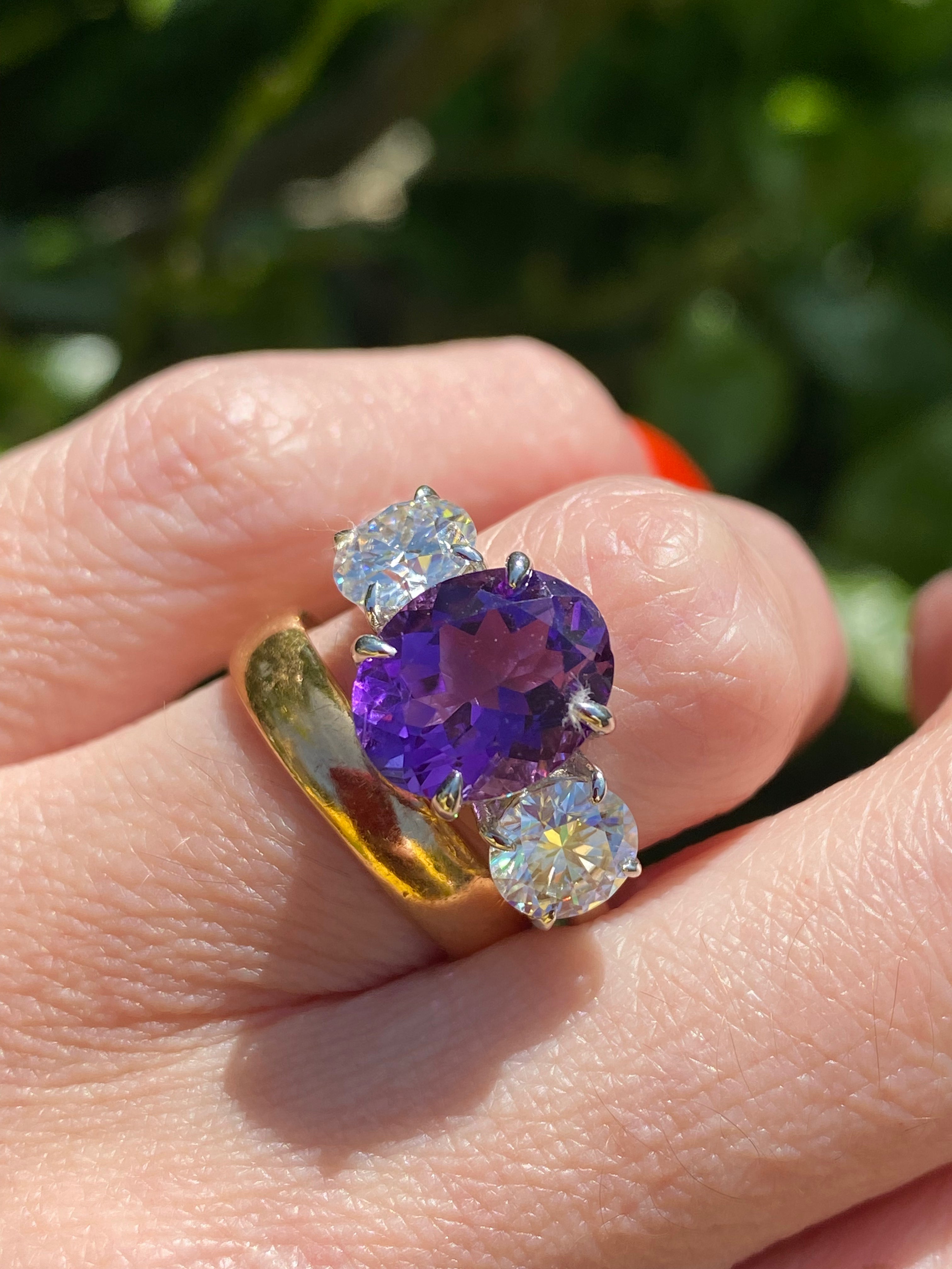 3.42 Carat Oval Cut Amethyst and 1.85 Carat Moissanite Three Stone Ring in Sterling Silver