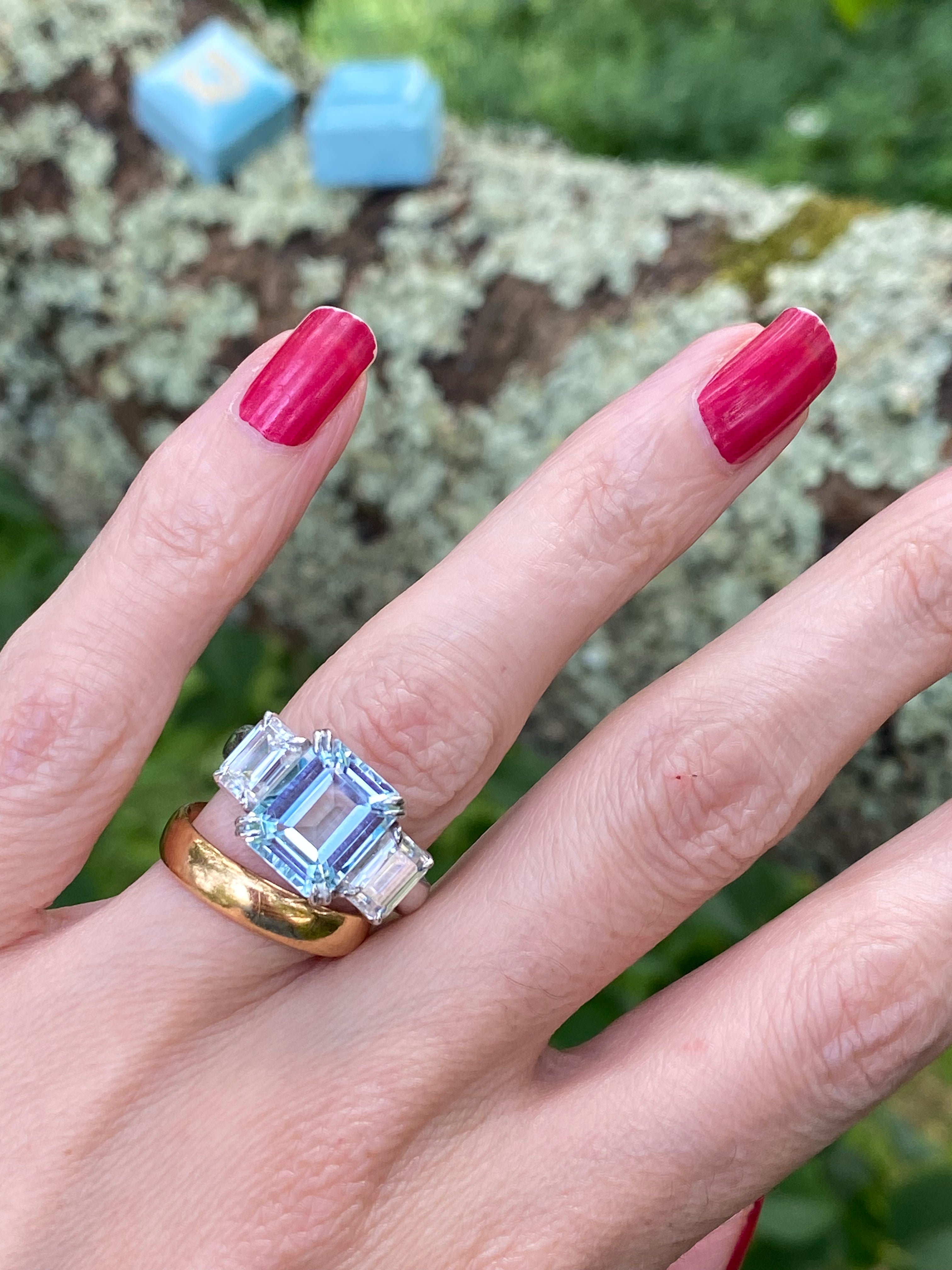 5.71 Carat Emerald Cut Blue Topaz and 2.00 Carat Moissanite Three Stone Ring in Sterling Silver