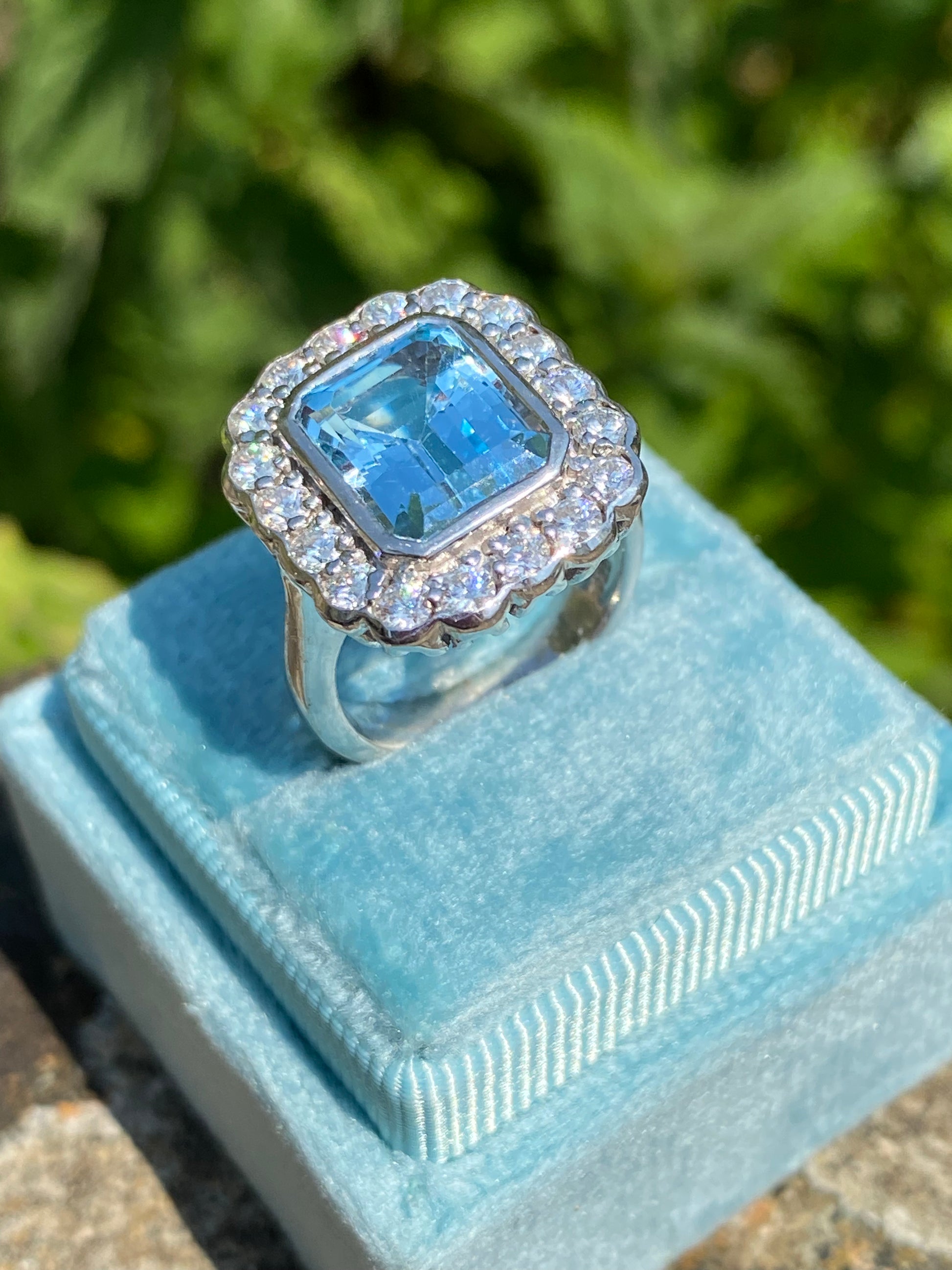 4.25 CTW Emerald Cut Blue Topaz and Moissanite Halo Cocktail Ring H Sterling Silver