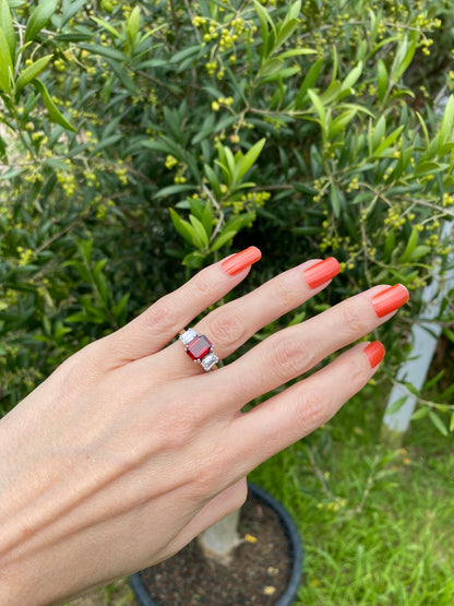 3.50 CTW Emerald Cut Garnet and Moissanite Three Stone Ring in Sterling Silver