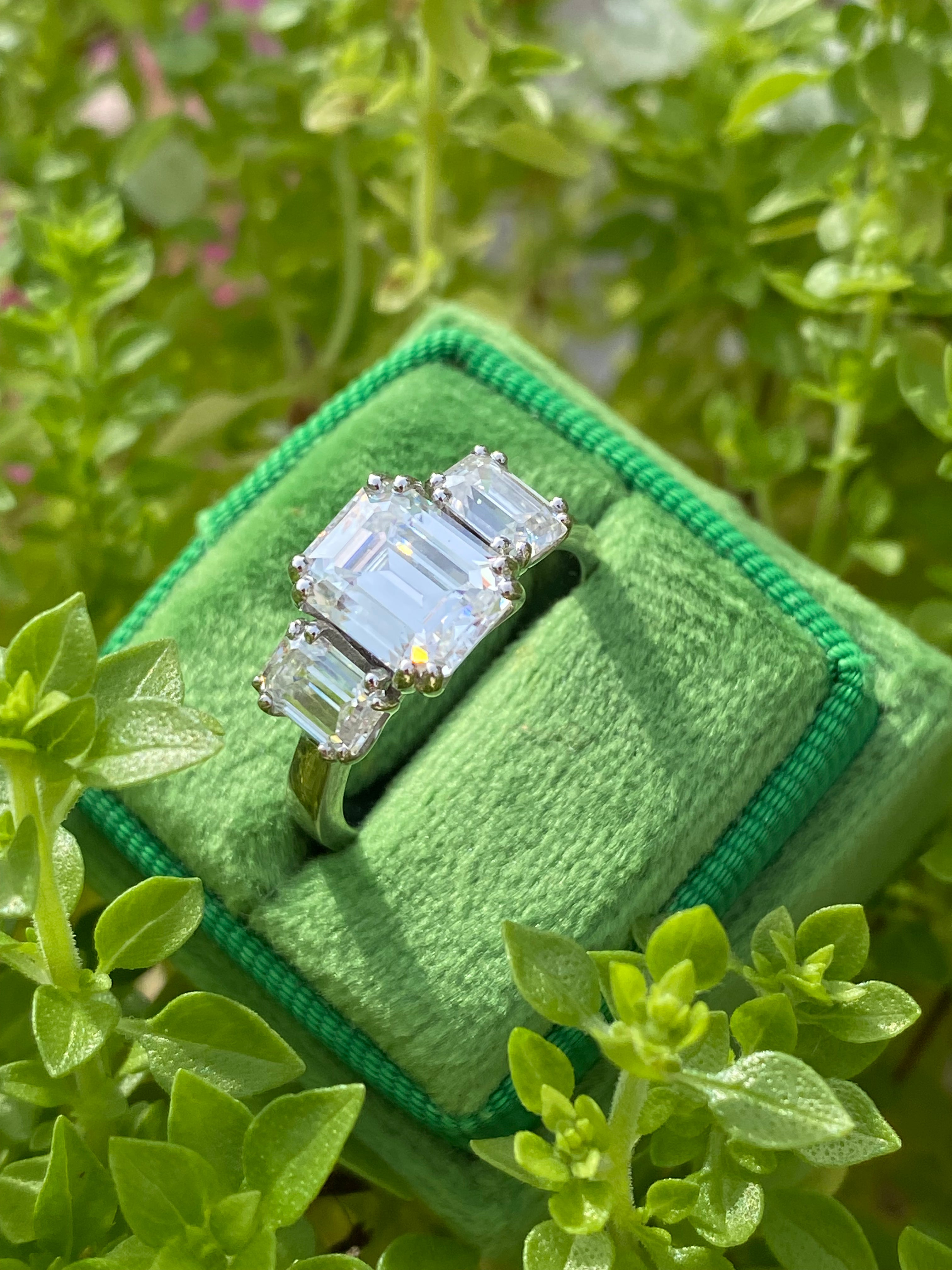 3.50 CTW Emerald Cut Moissanite Three Stone Ring in Sterling Silver