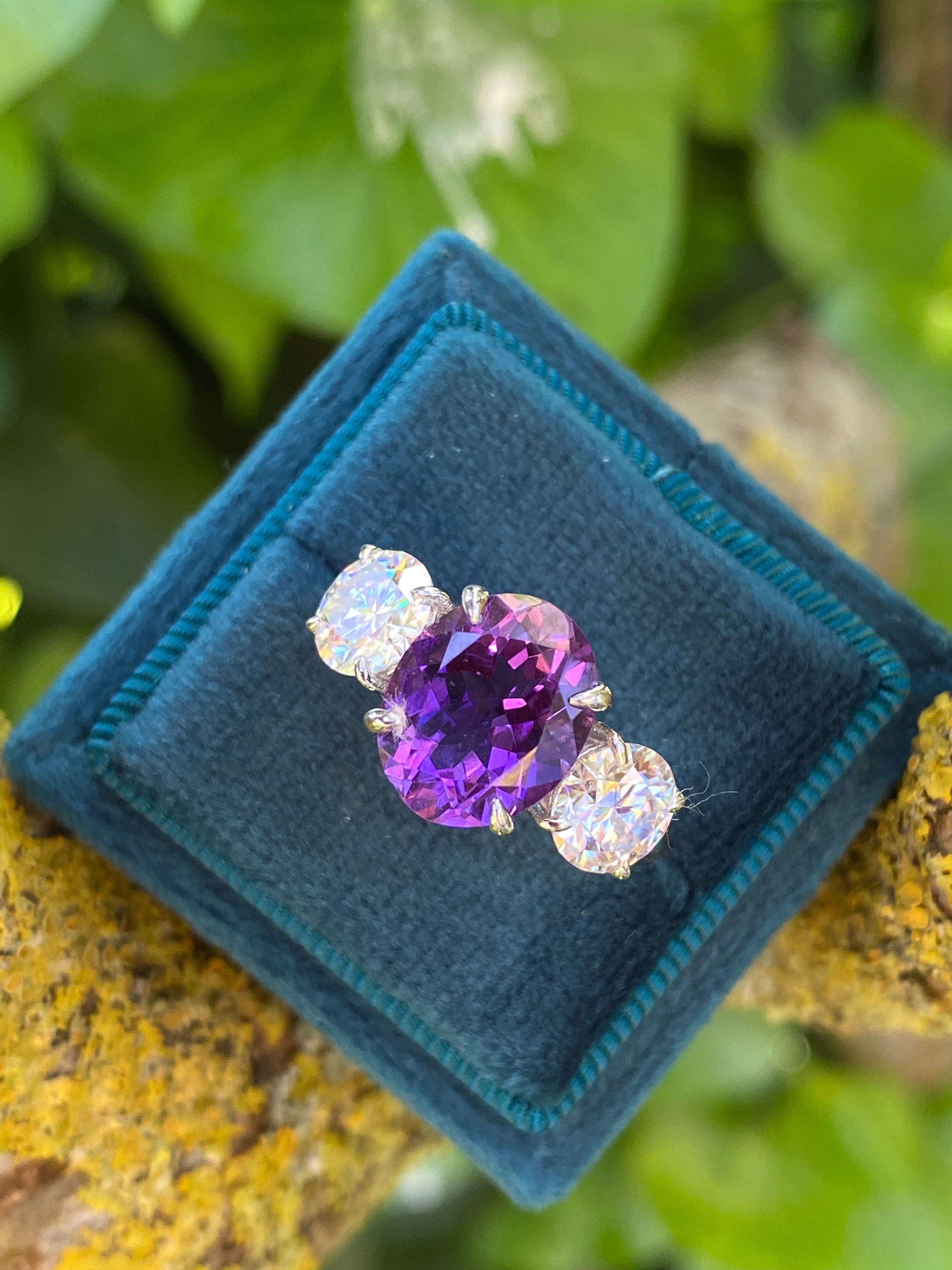 3.42 Carat Oval Cut Amethyst and 1.85 Carat Moissanite Three Stone Ring in Sterling Silver