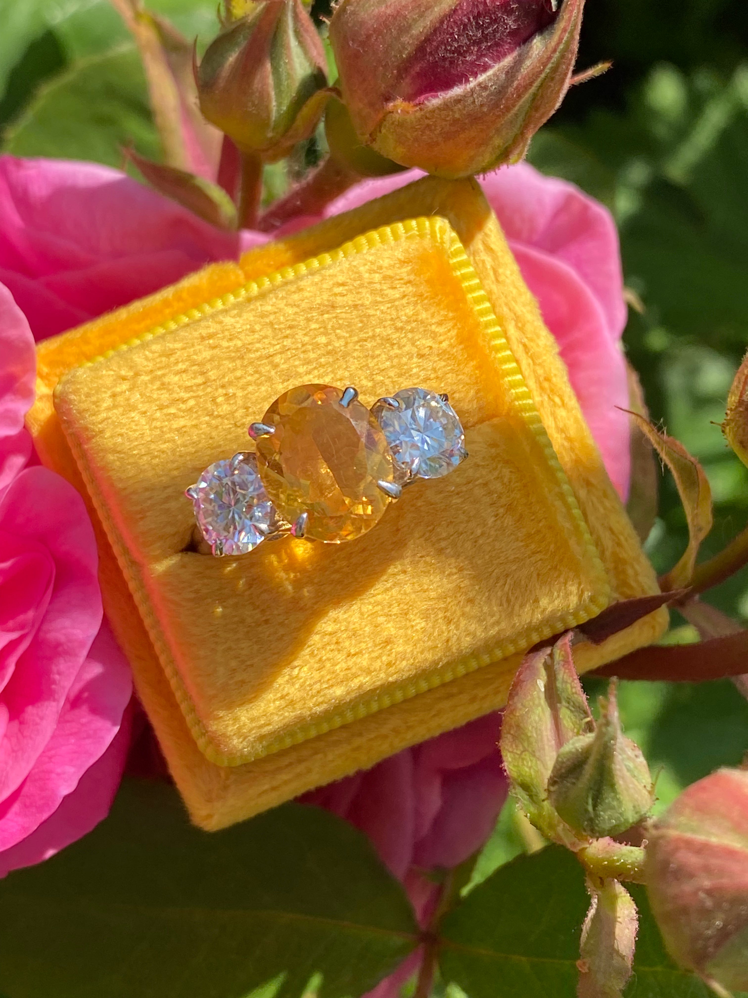 2.66 Carat Oval Cut Citrine and 1.85 Carat Moissanite Three Stone Ring in Sterling Silver