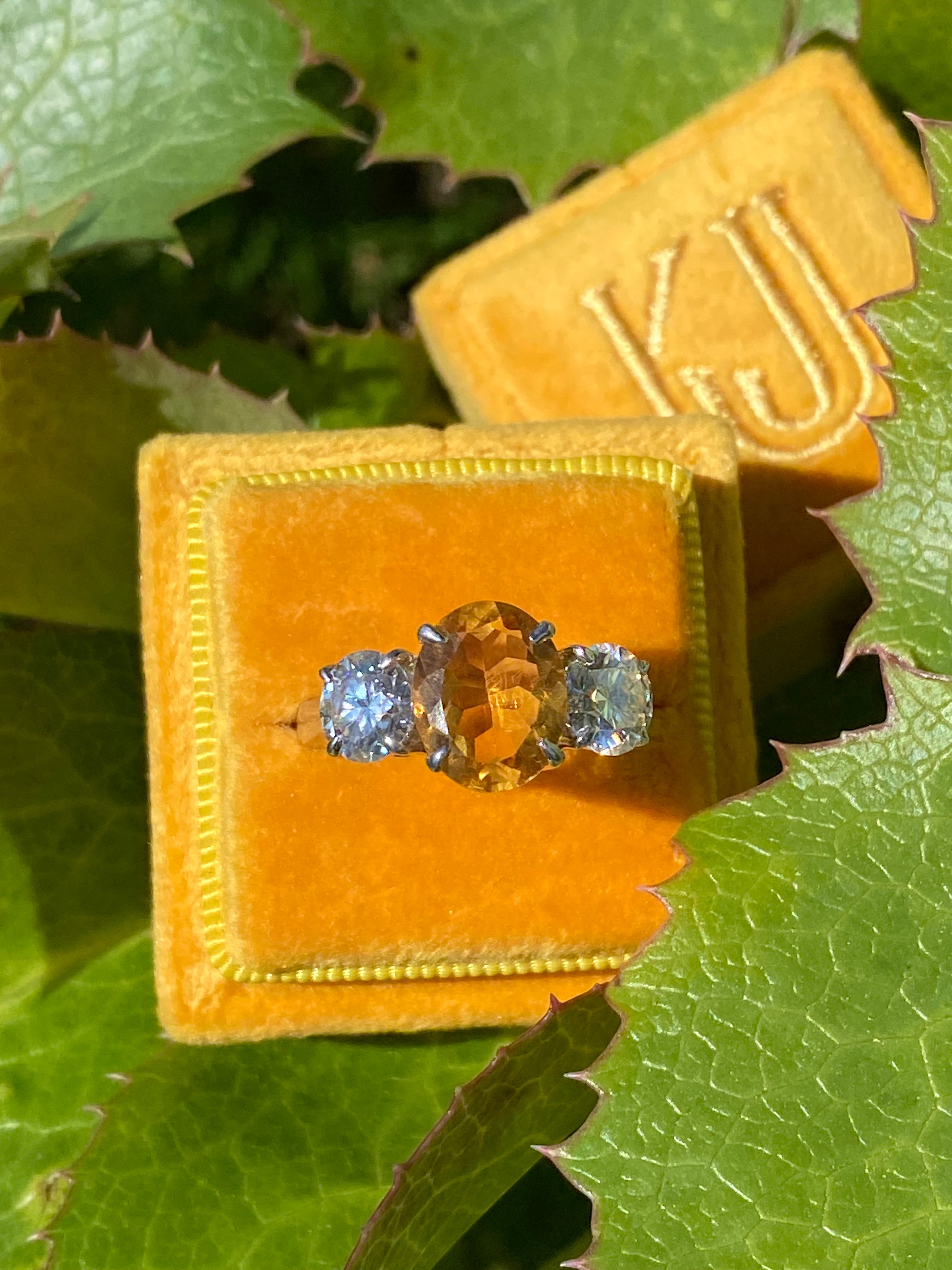 2.66 Carat Oval Cut Citrine and 1.85 Carat Moissanite Three Stone Ring in Sterling Silver